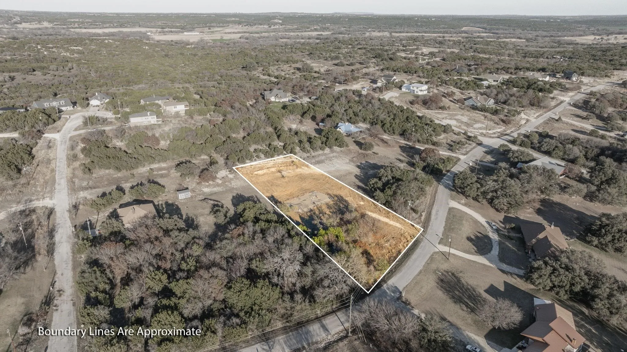 Aerial view of property's location featuring property parcel outlined