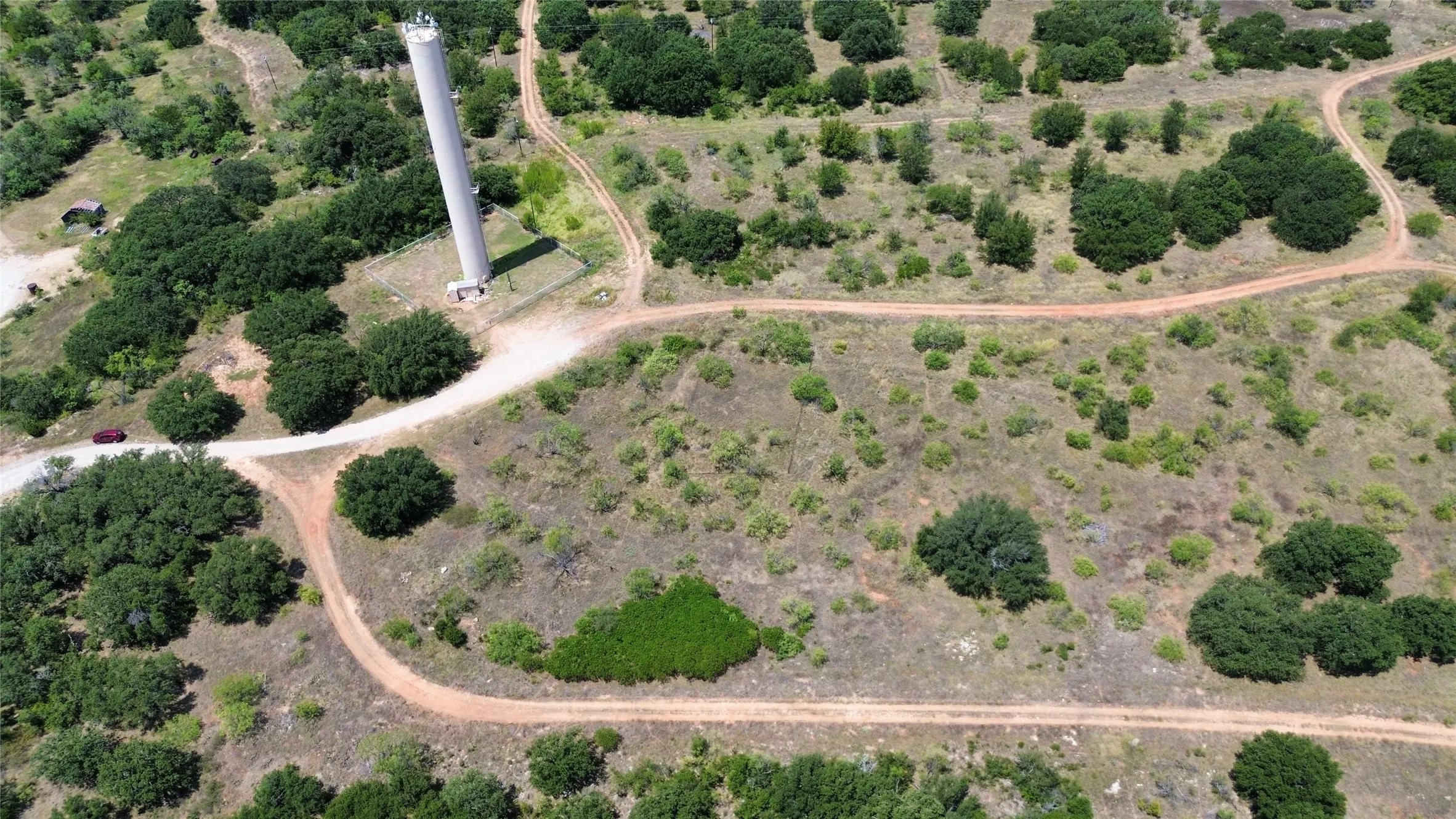 Aerial view of property and surrounding area with rural landscape