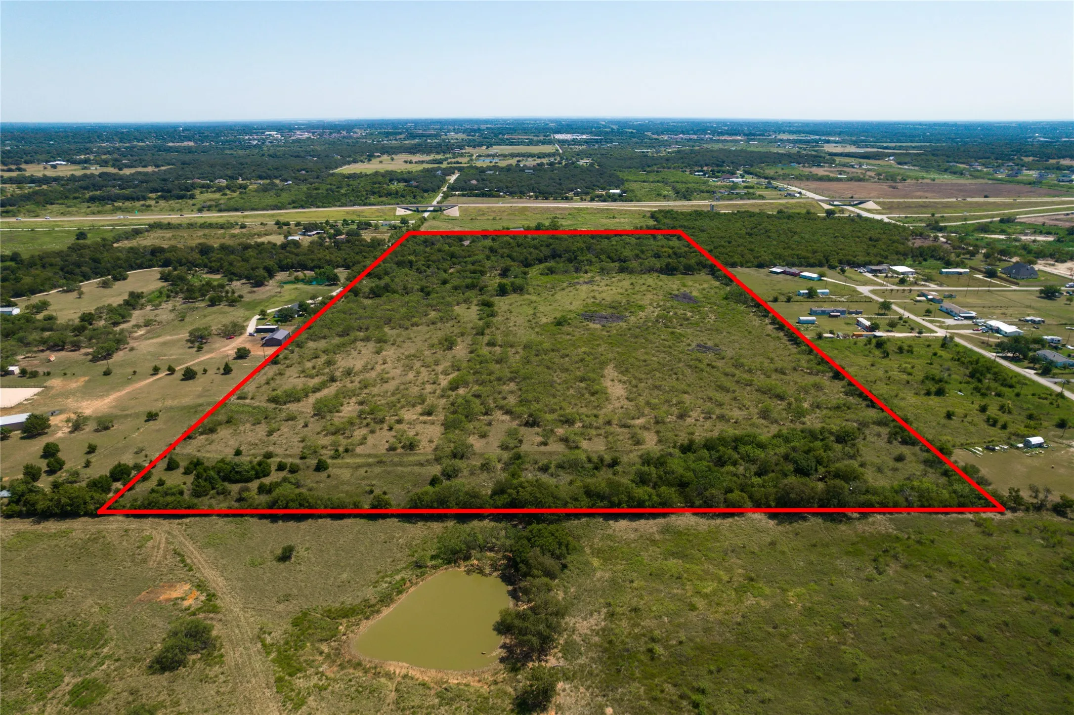 Overview of rural landscape featuring property boundaries highlighted