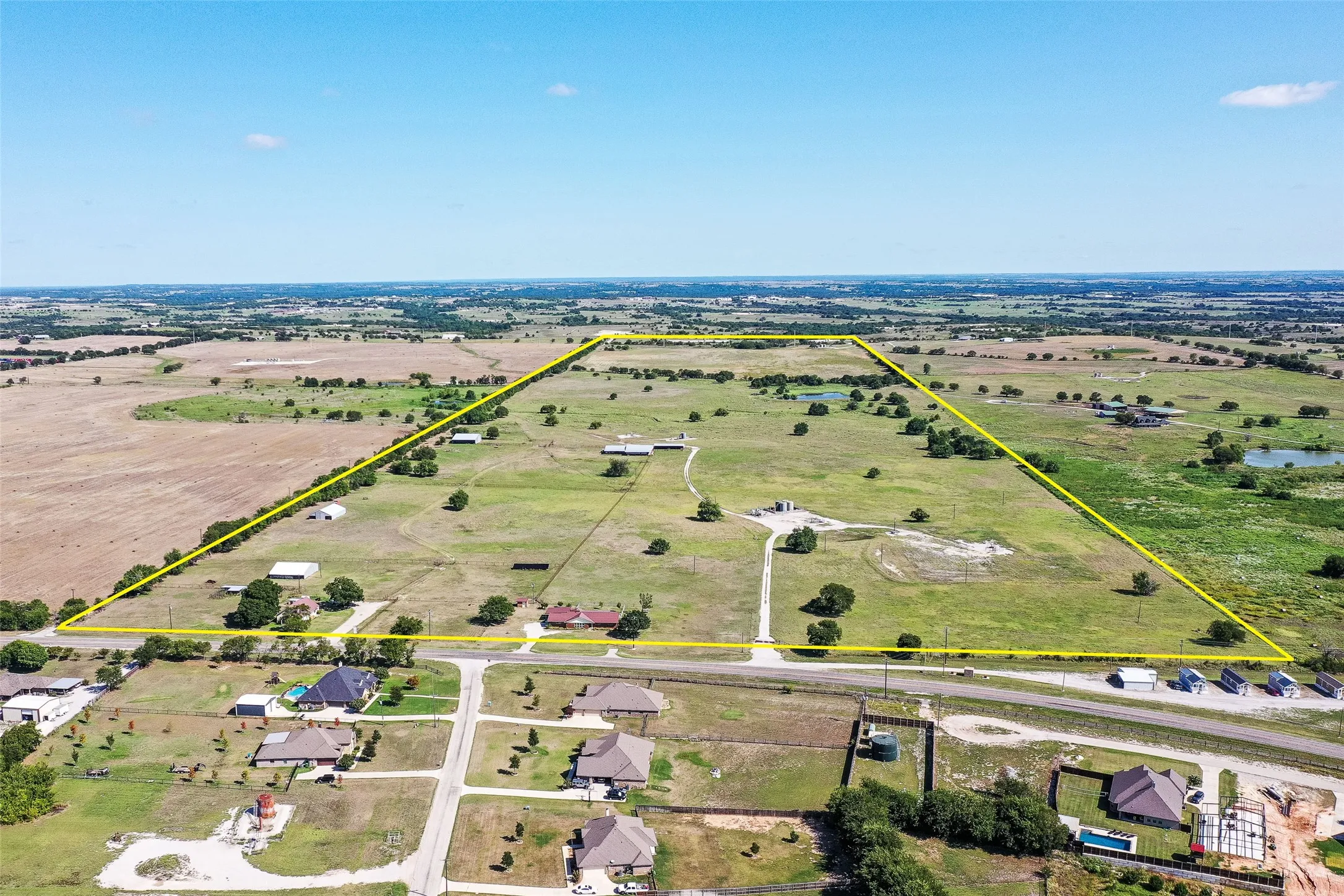 Overview of rural landscape with property parcel outlined