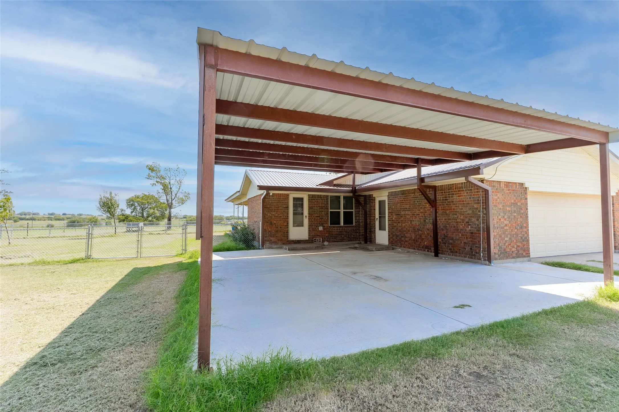 View of patio featuring an attached carport