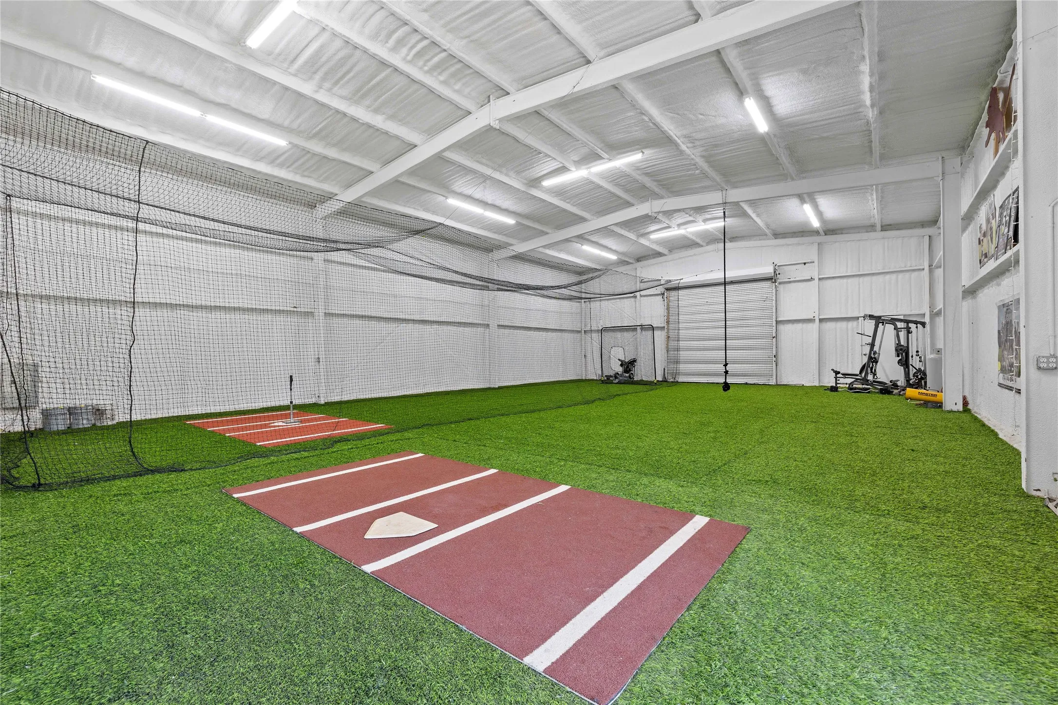 View of property's community with metal wall and lofted ceiling
