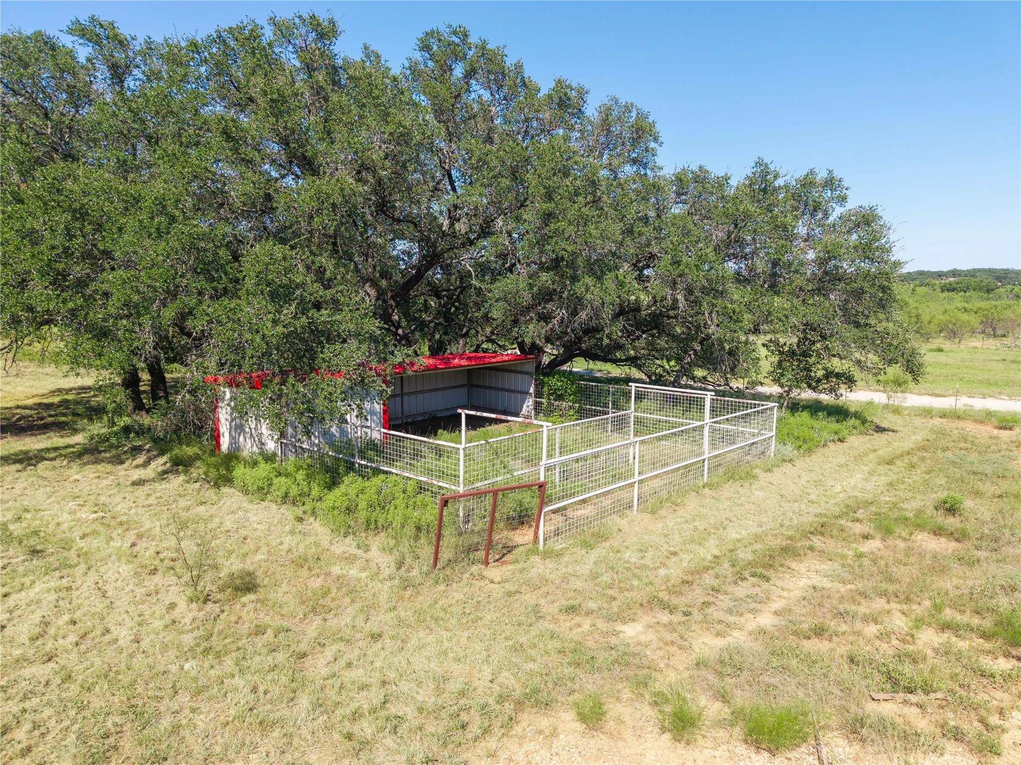 View of yard featuring a view of rural / pastoral area, an outbuilding, and a pole building