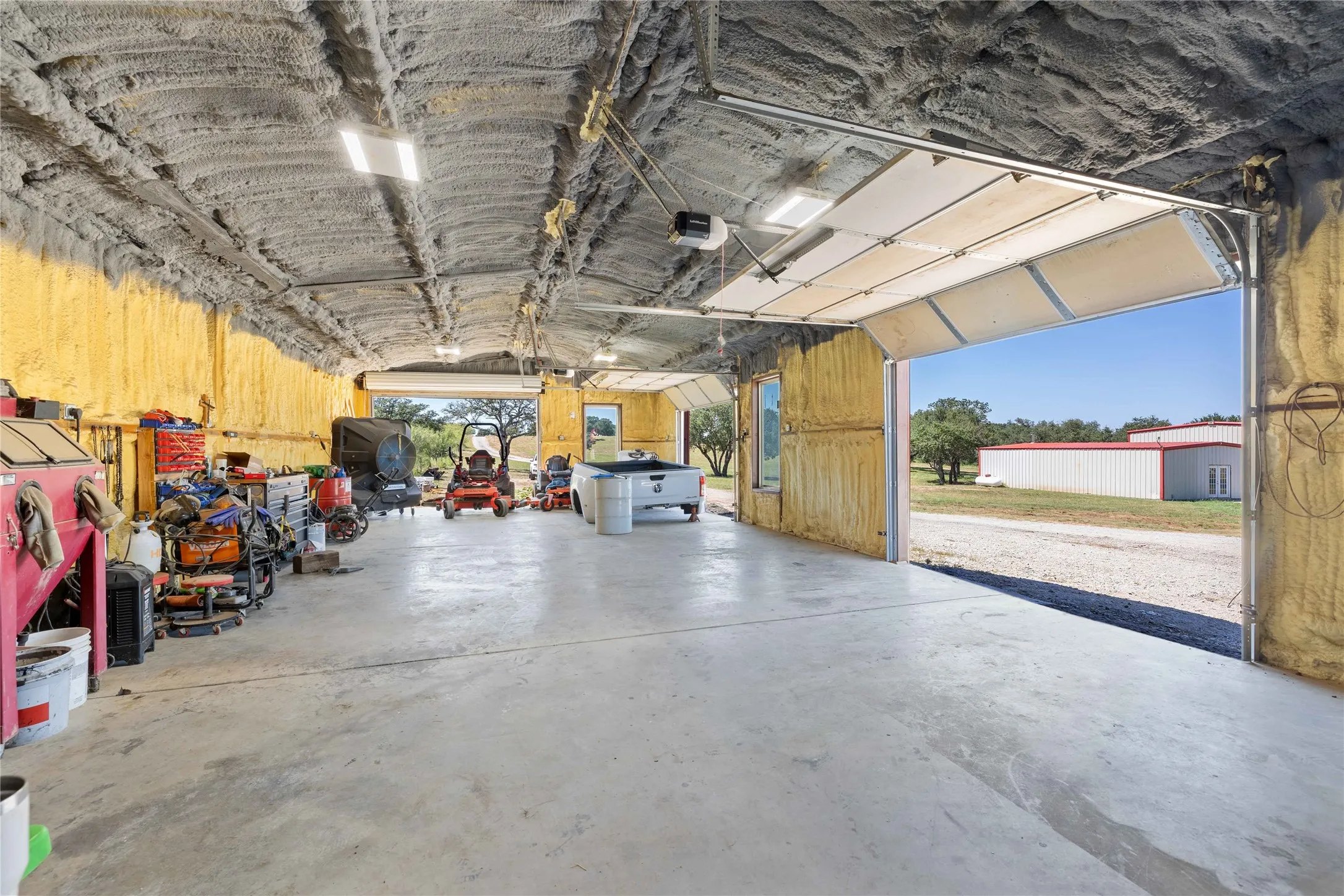 Garage featuring a garage door opener