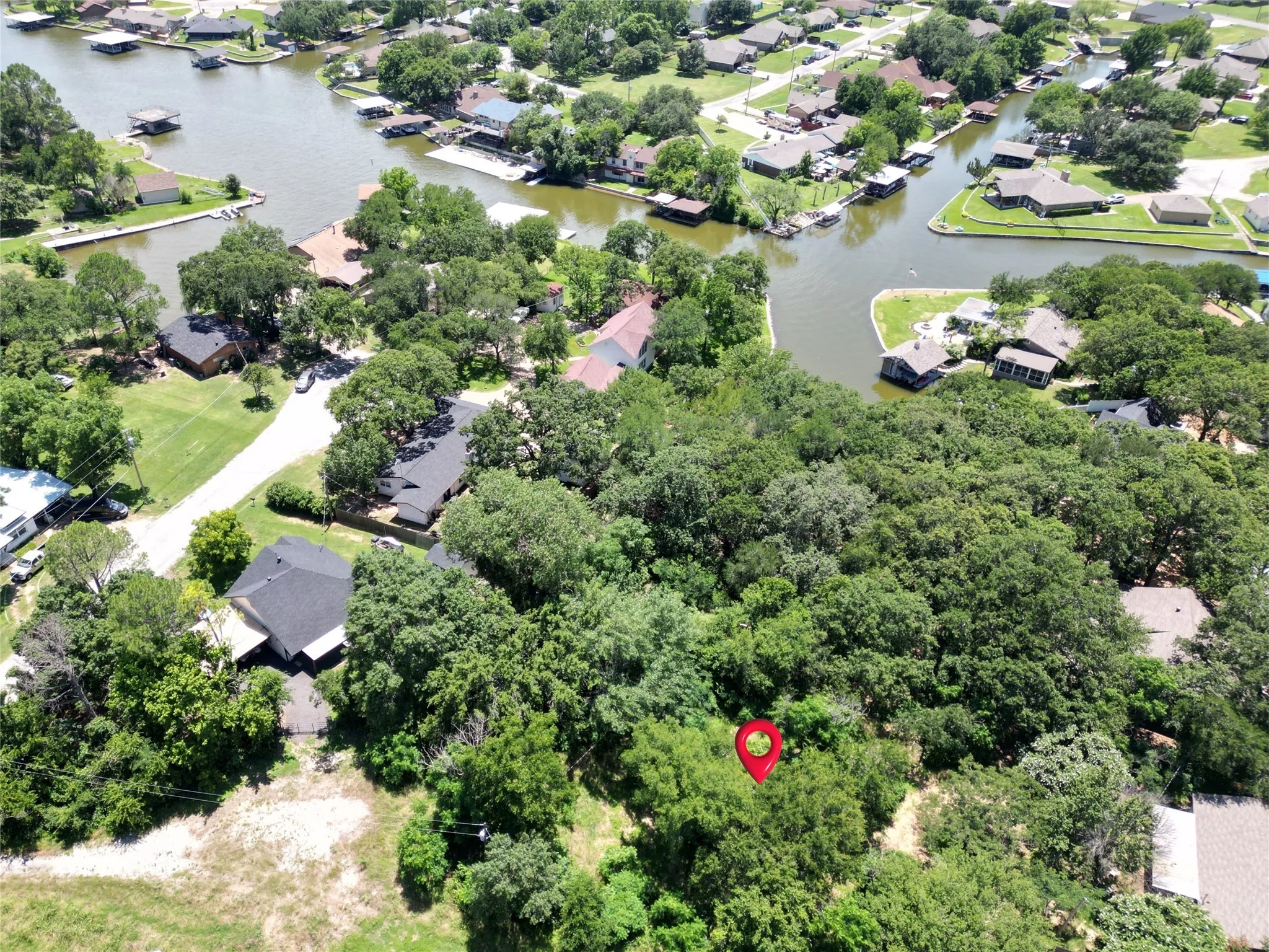 Aerial perspective of suburban area with a nearby body of water