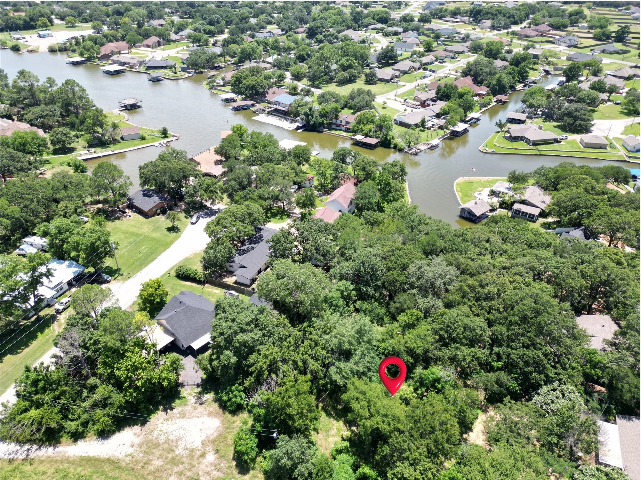 Aerial perspective of suburban area with a large body of water