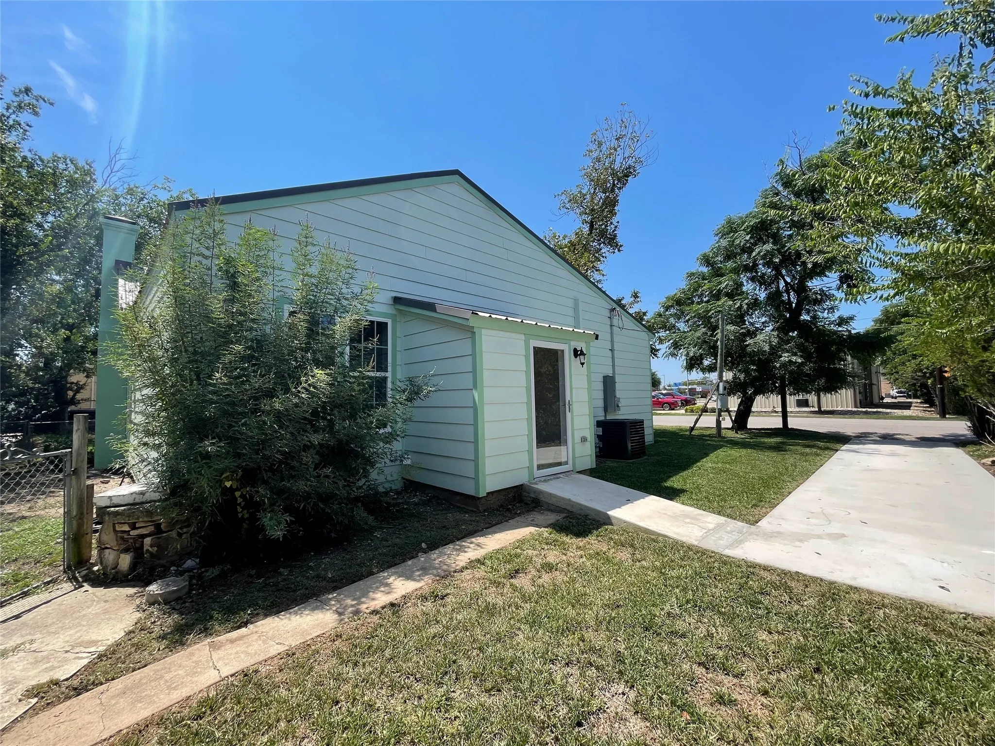 Back of property featuring a yard