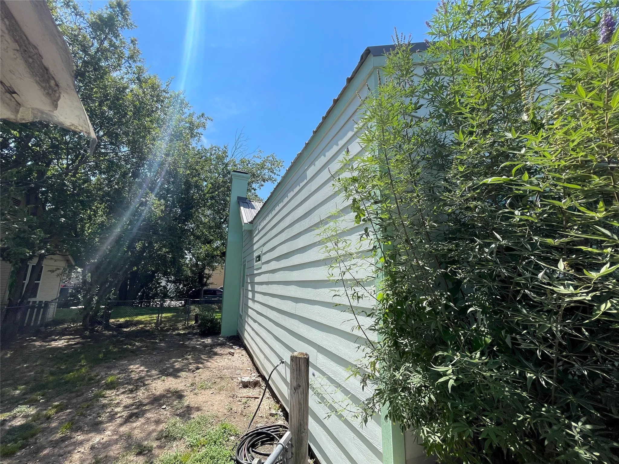 View of side of property with a chimney