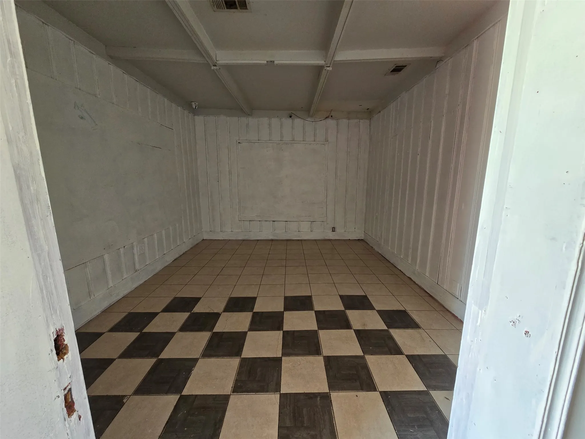 Unfurnished room featuring light floors
