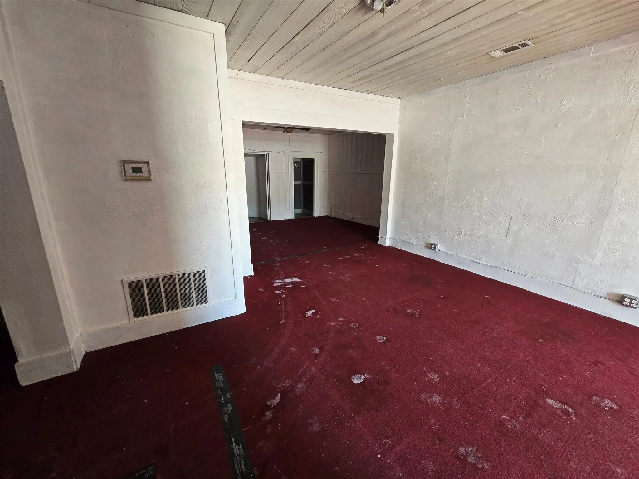 Unfurnished room featuring wooden ceiling