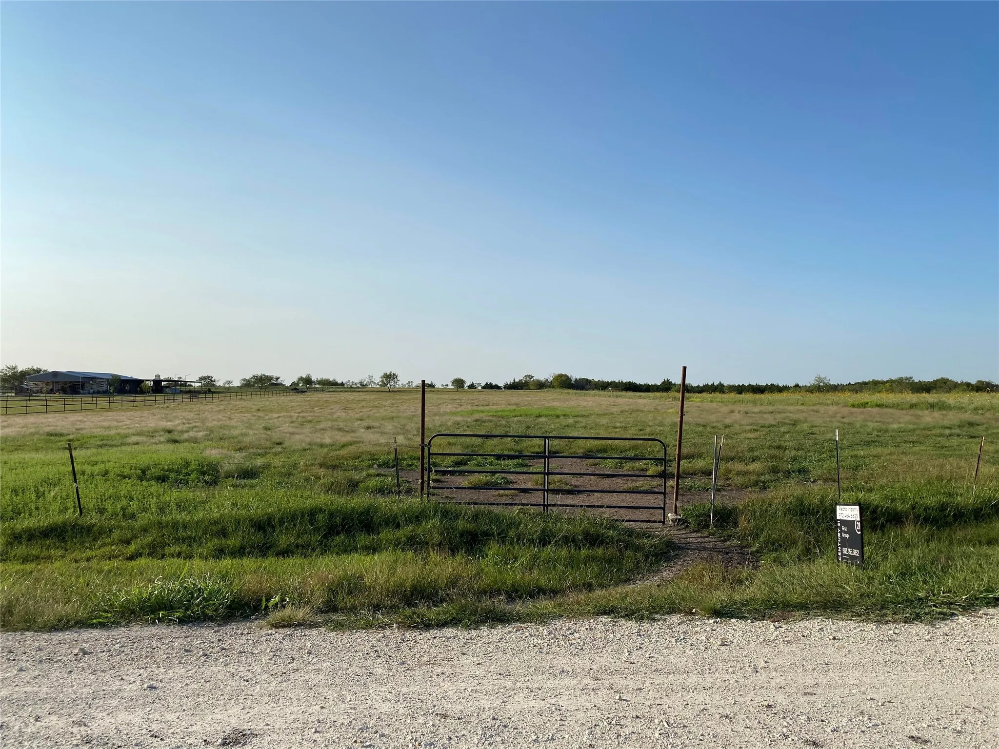 View of yard with a view of rural / pastoral area and a gate
