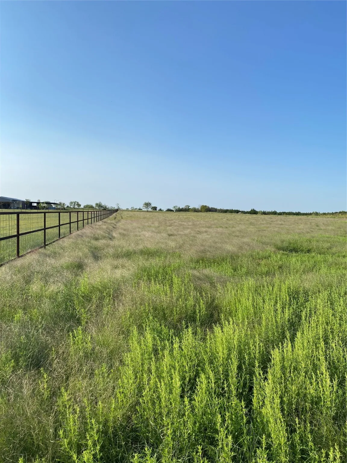 View of yard with a rural view