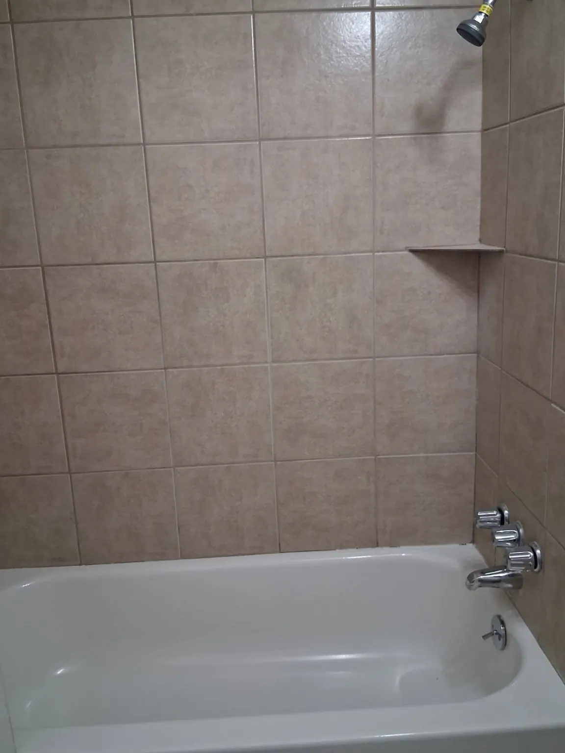 Bathroom featuring washtub / shower combination