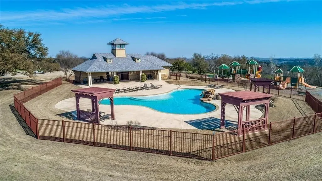 Community pool with a patio area