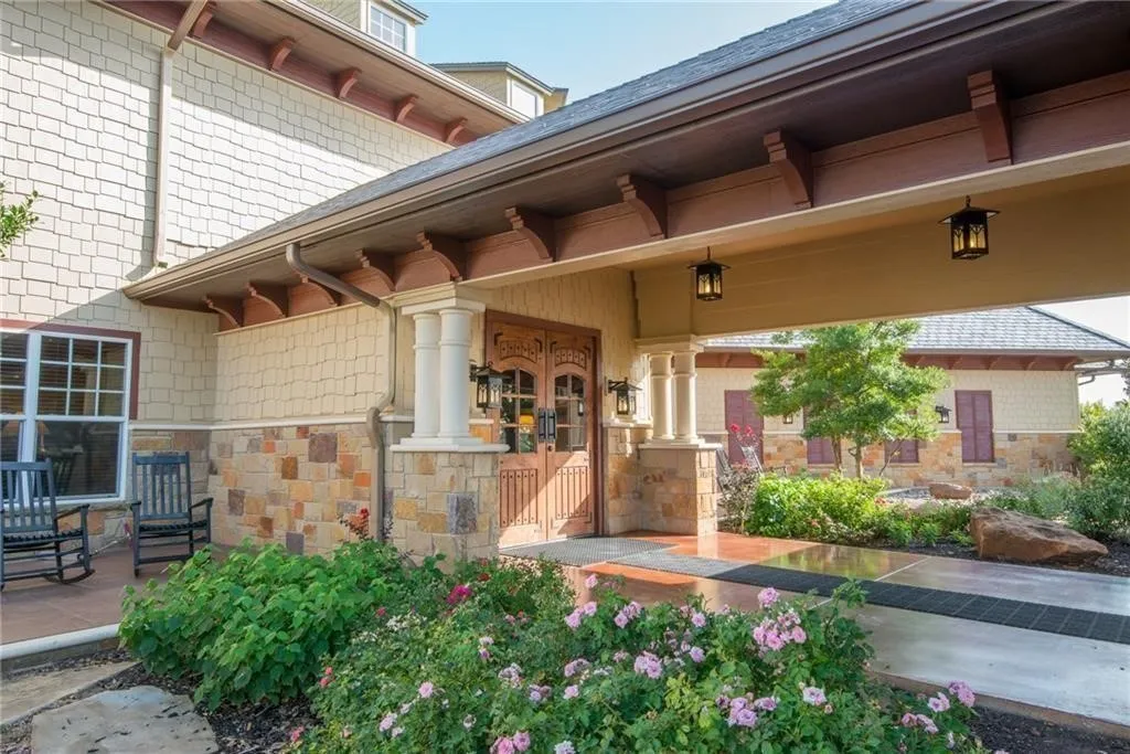 Doorway to property featuring stone siding