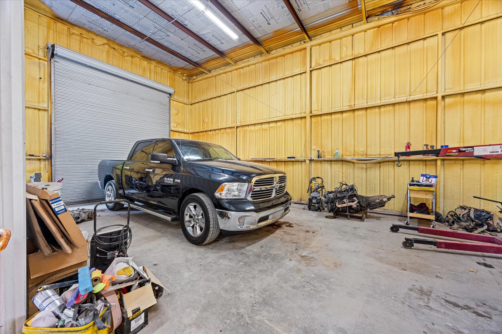 Garage featuring metal wall