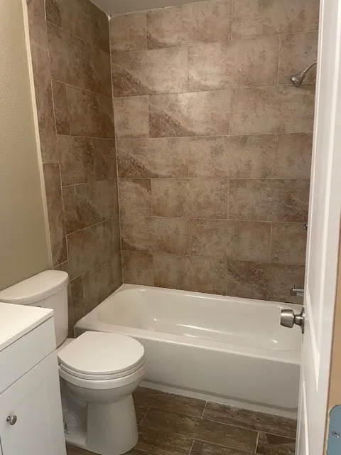 Full bath with shower / bath combination and vanity