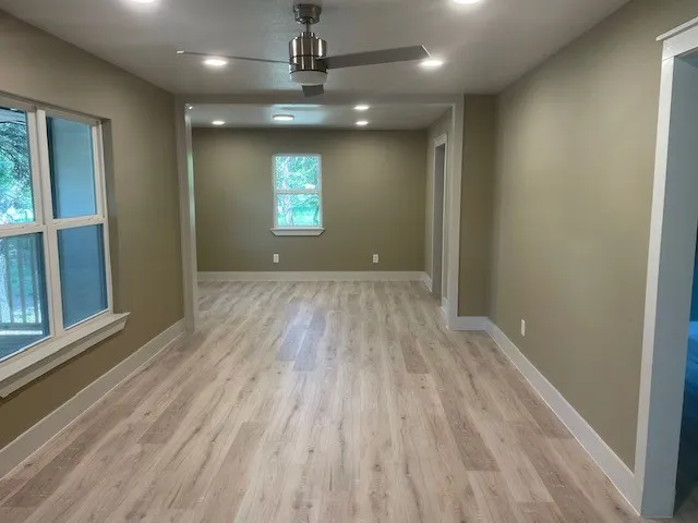 Spare room featuring recessed lighting, a ceiling fan, and light wood finished floors