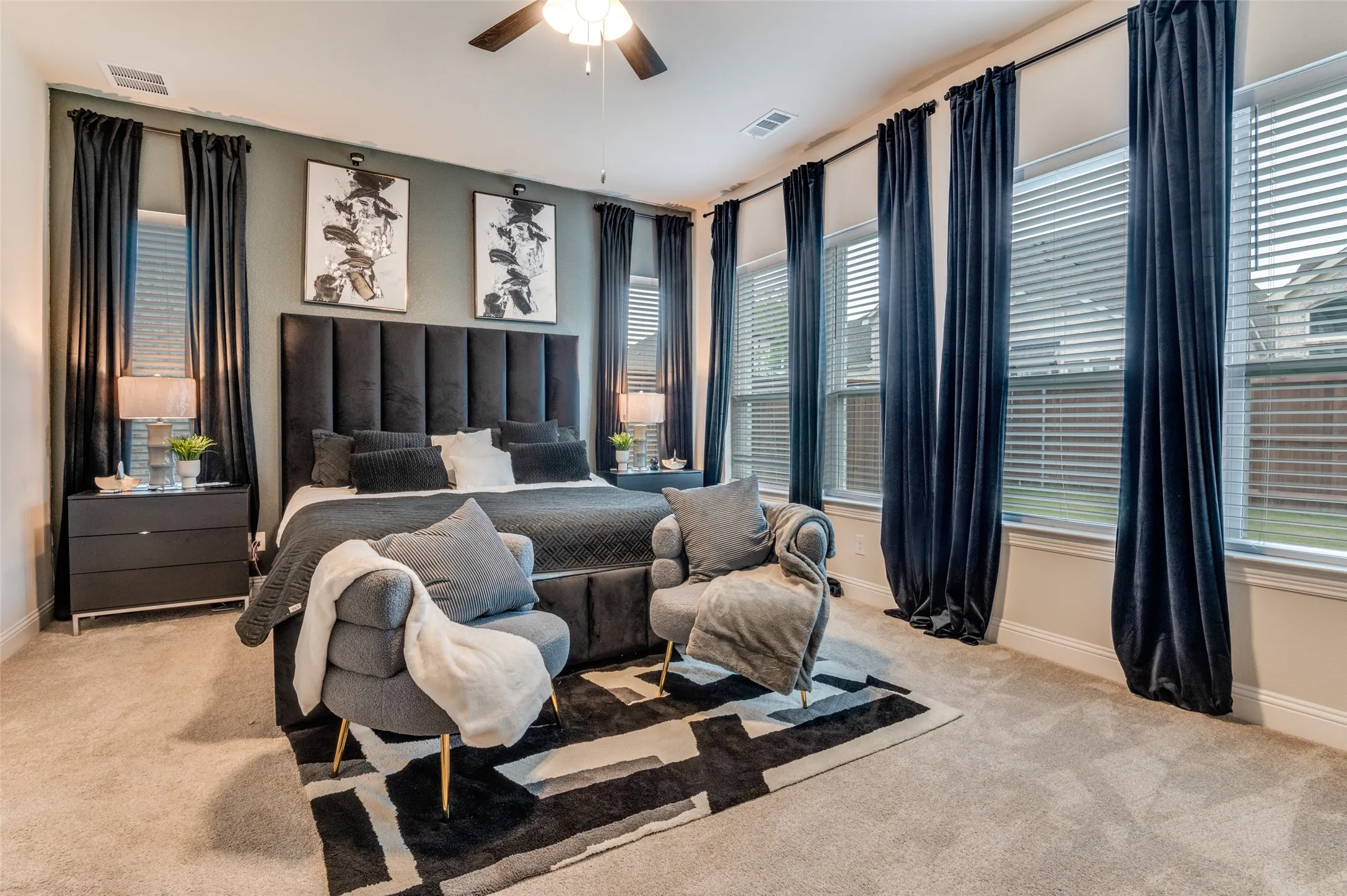 Bedroom featuring light carpet and ceiling fan