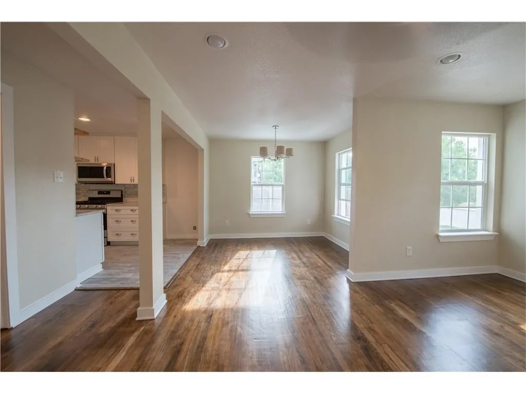 Opens to Living Area and Kitchen