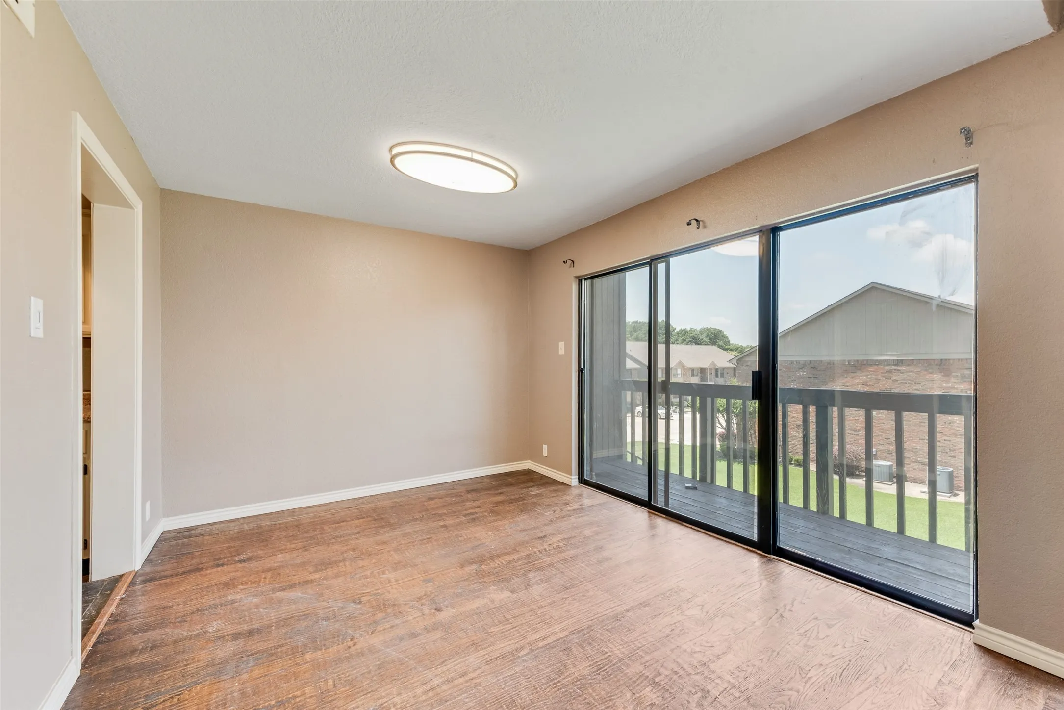 Unfurnished room with baseboards and light wood-style floors
