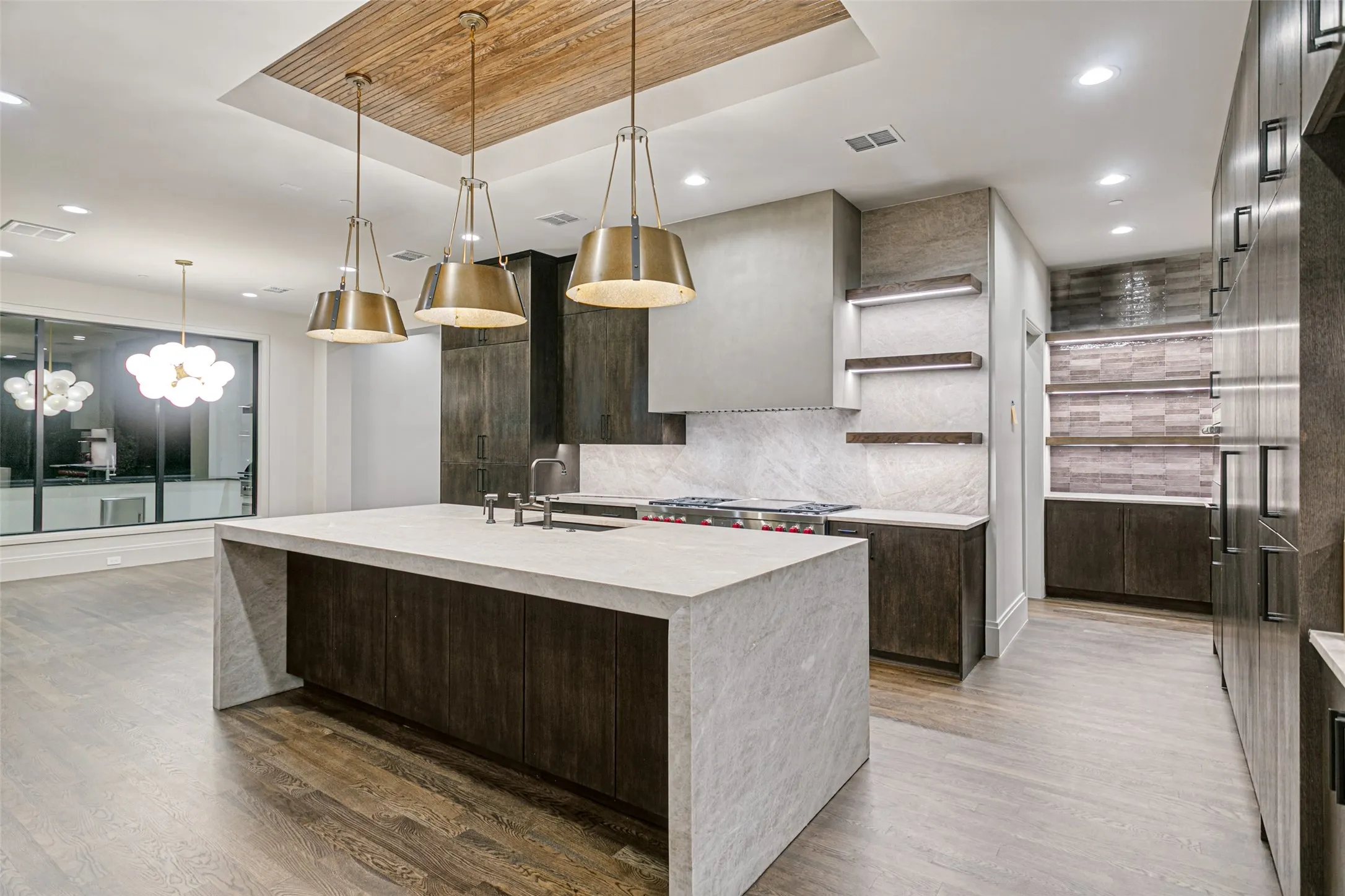 Stunning kitchen with floating shelves and pendant lighting