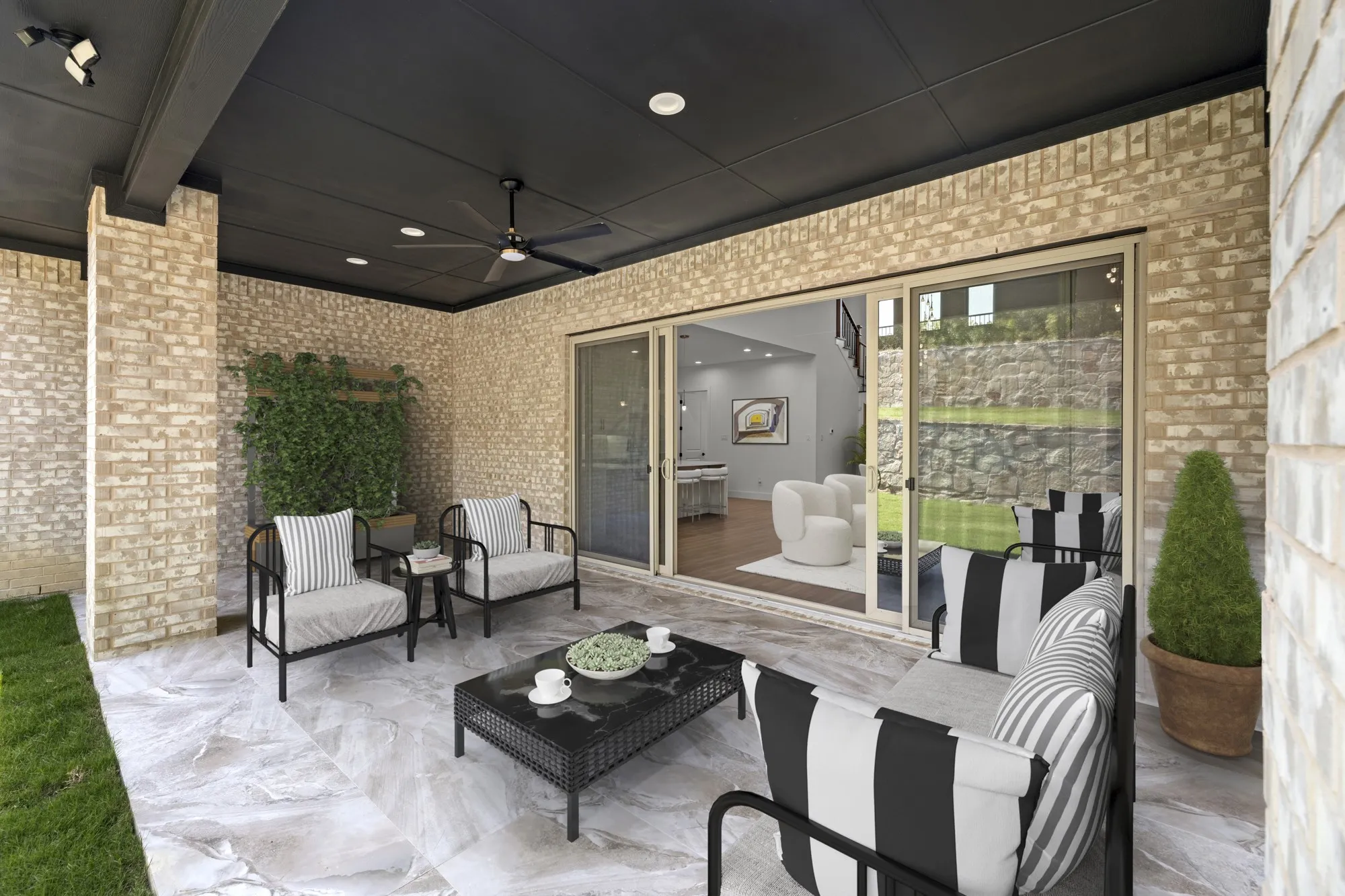 Virtually staged covered back patio with gas stub out for an outdoor kitchen.  Backyard faces East making for an expansive shaded area in the afternoons!