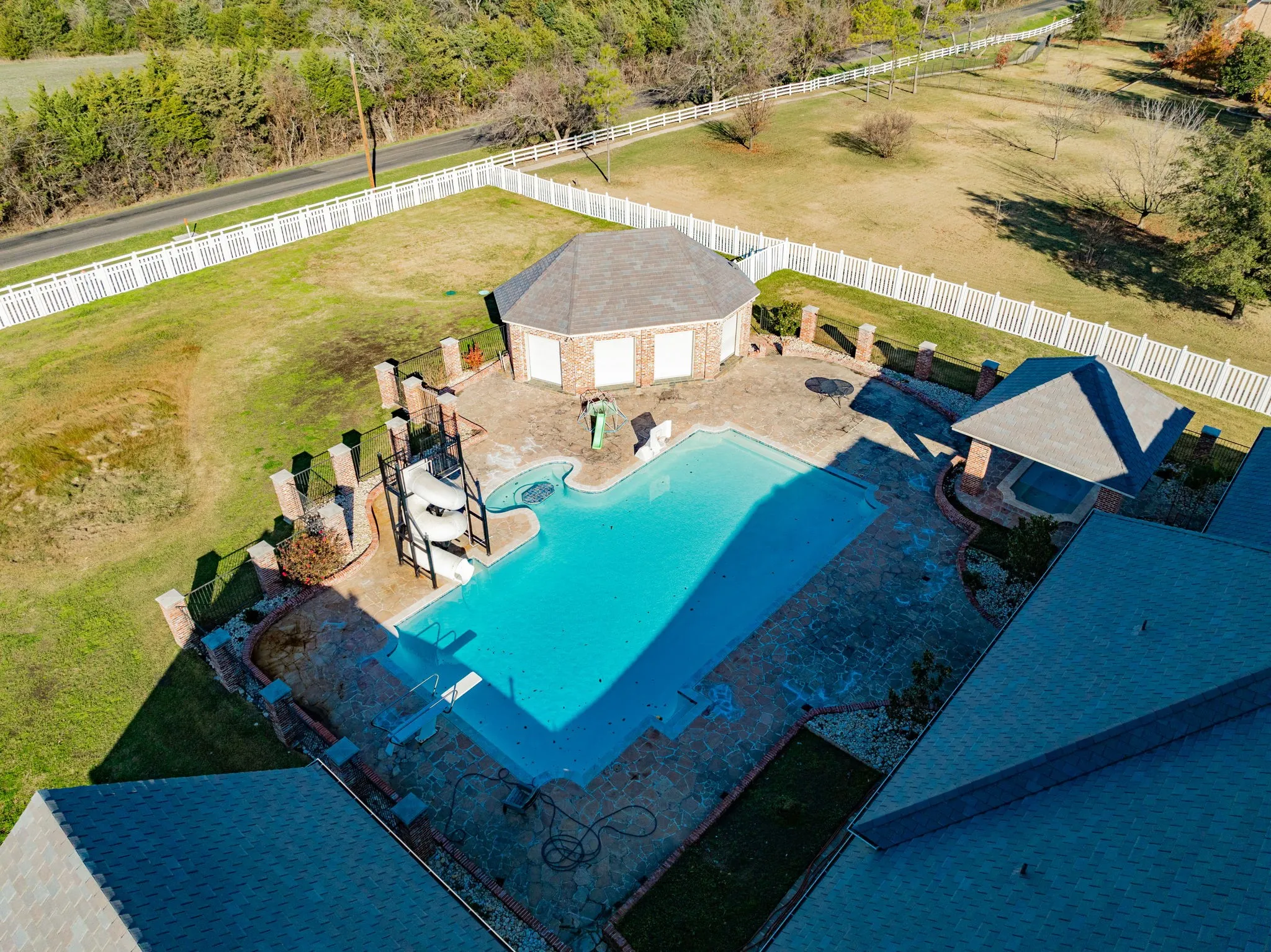 View of rural area featuring a pool