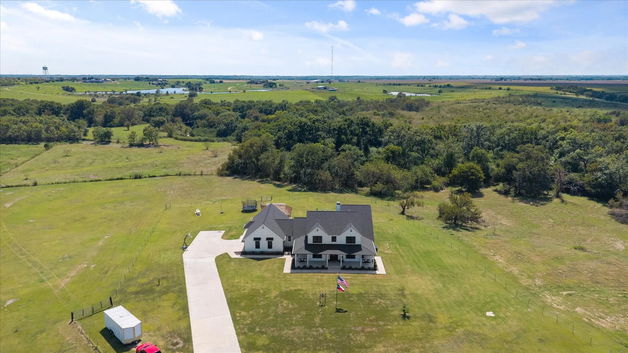 Gorgeous modern farmhouse on 38+ acres with live-in horse facilities!