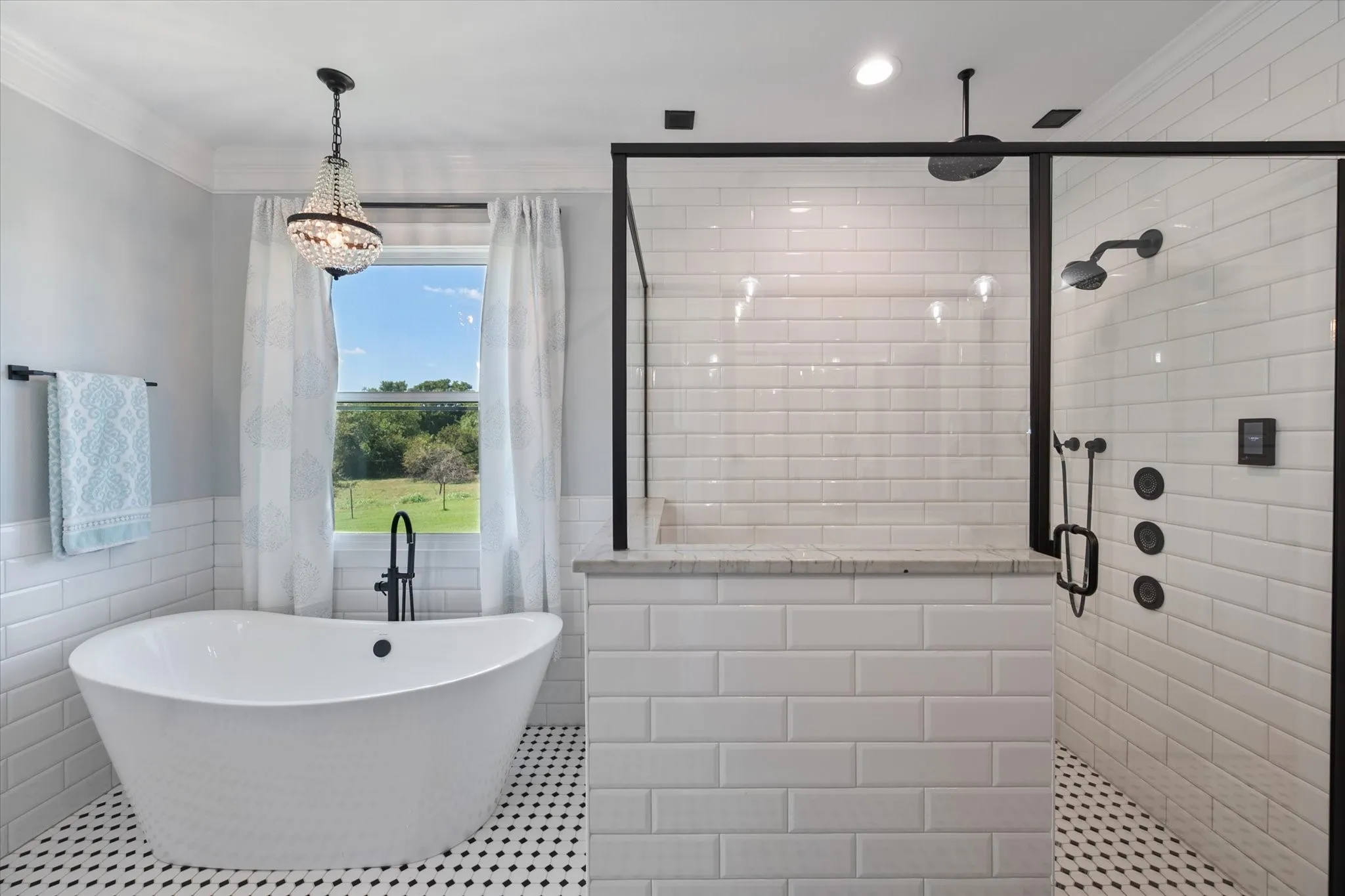Ensuite bath features soaking tub and oversized walk-in shower