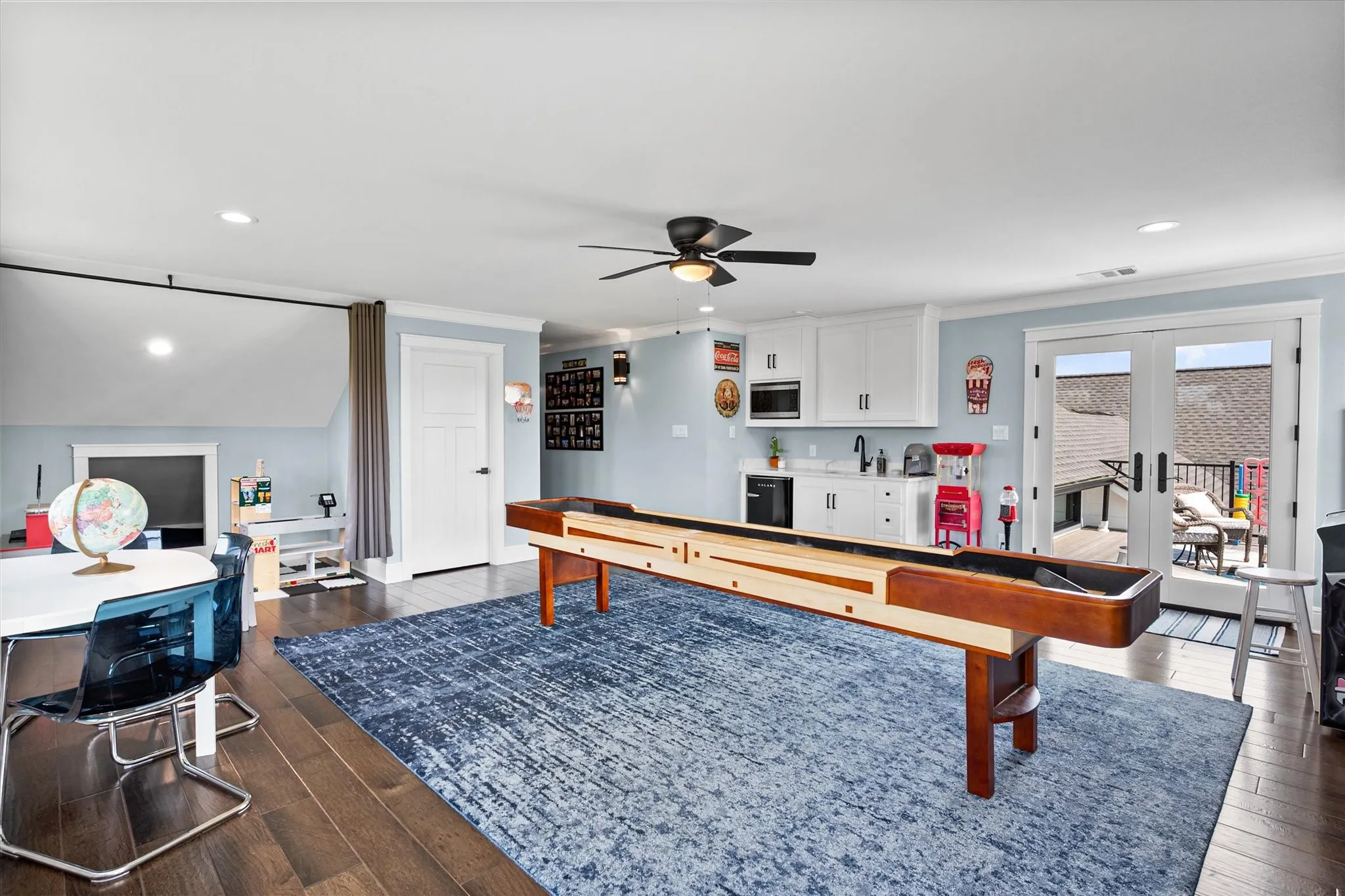 The game room upstairs includes an entry to the balcony