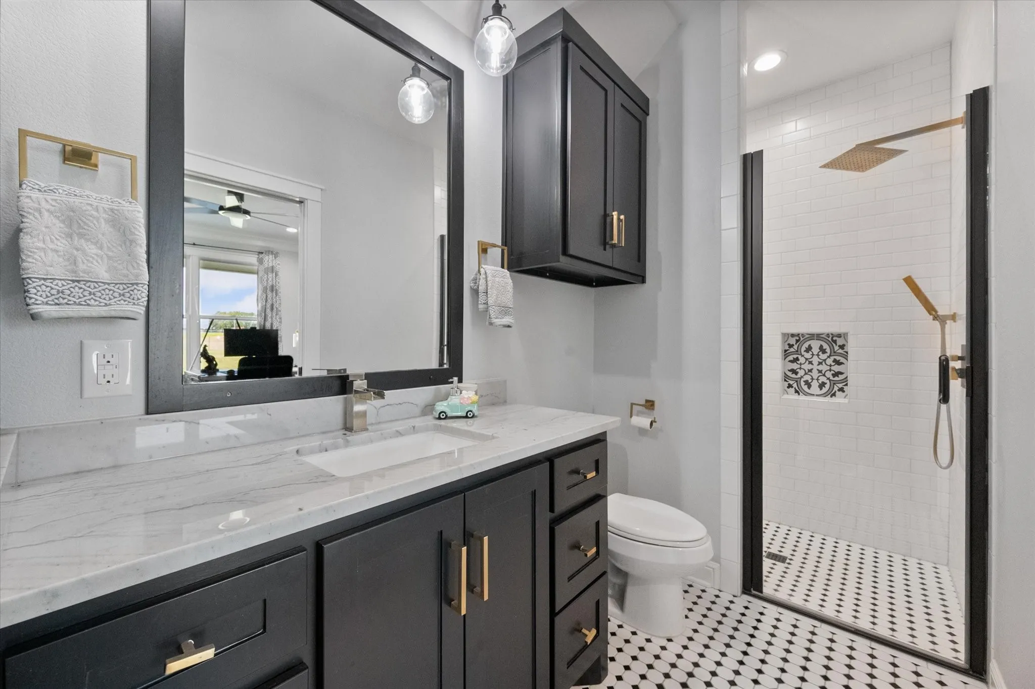 Designer tile throughout the bathrooms