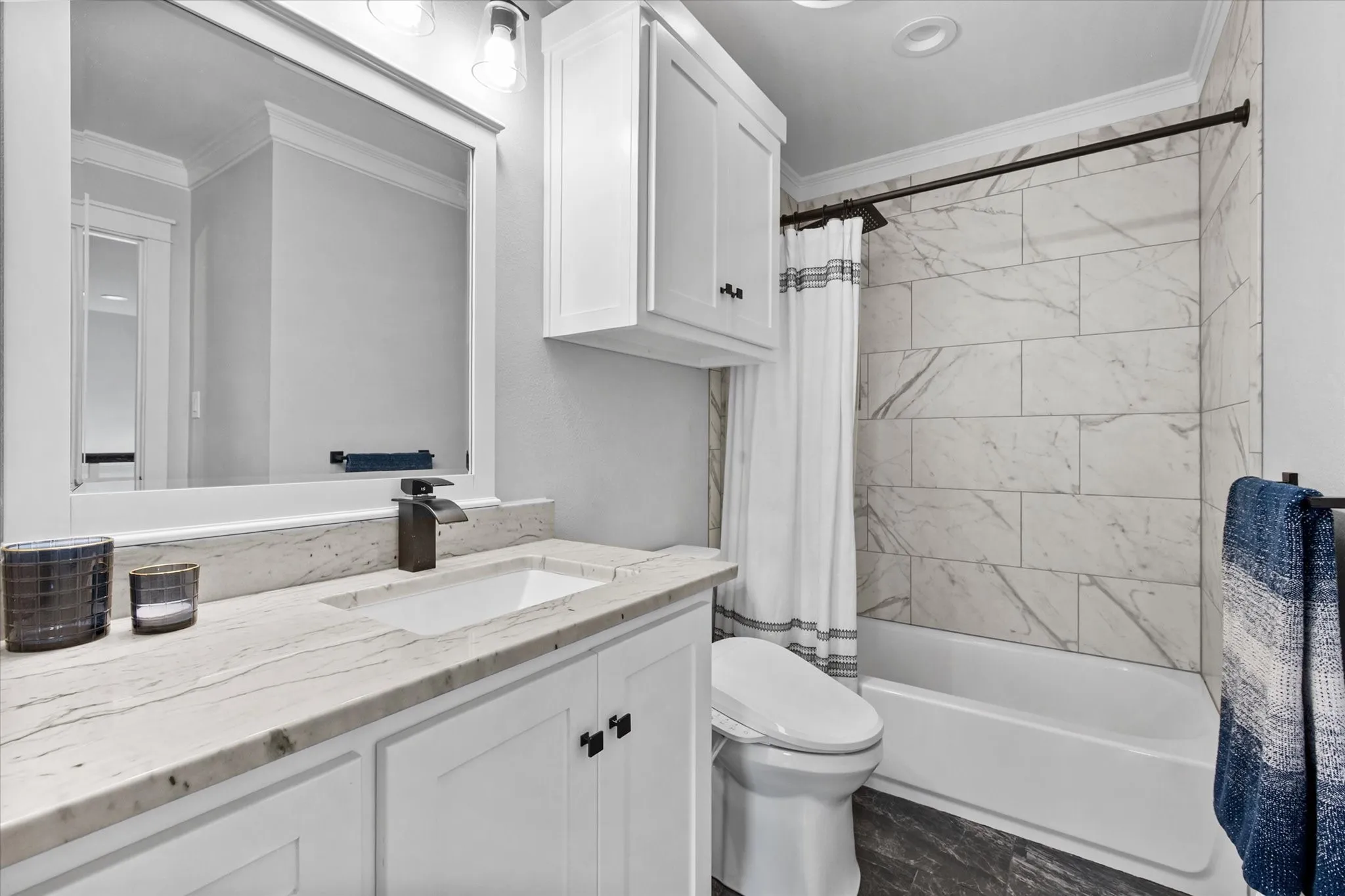 Designer tile throughout the bathrooms