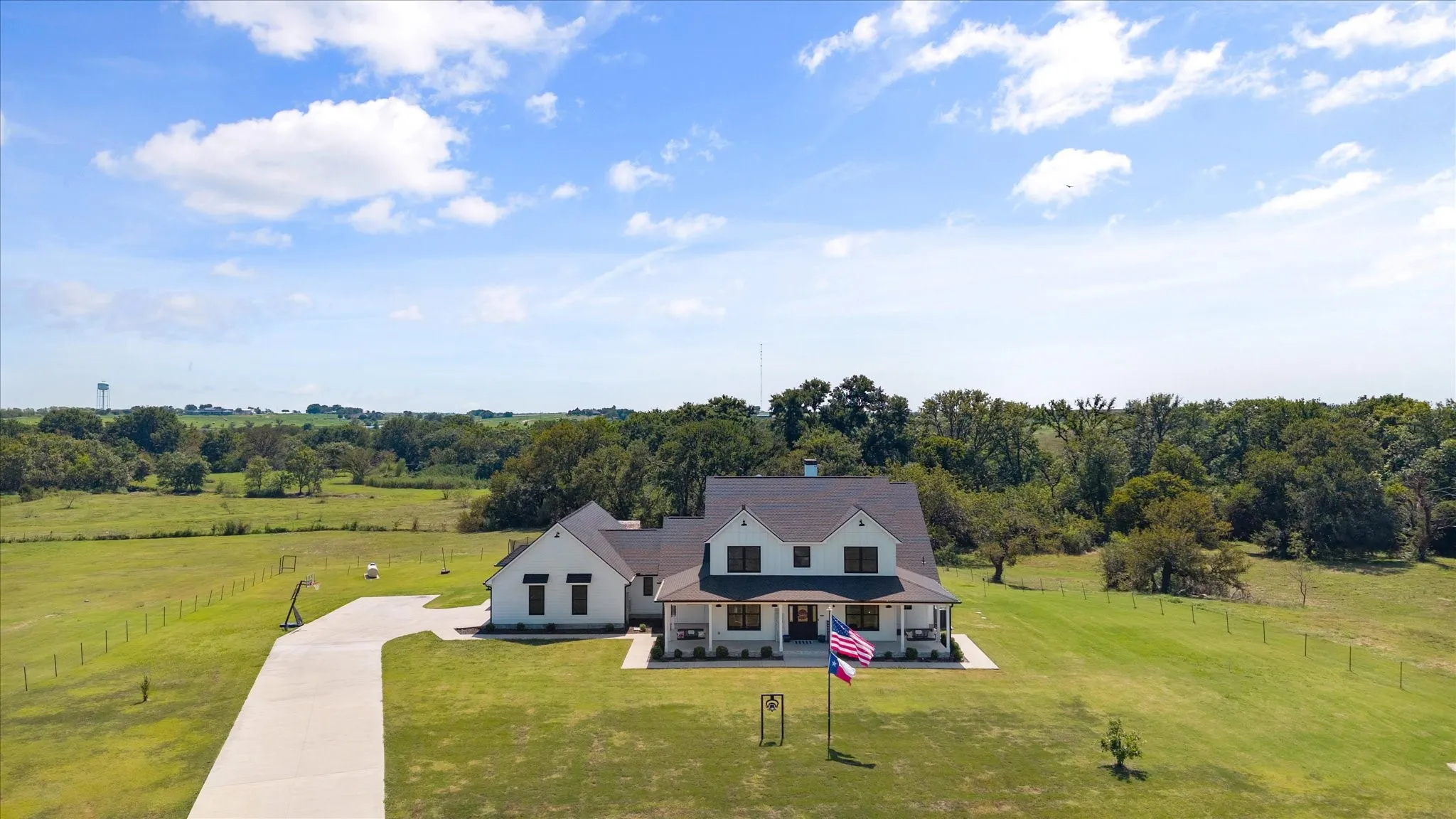 Gorgeous modern farmhouse on 38+ acres with live-in horse facilities!