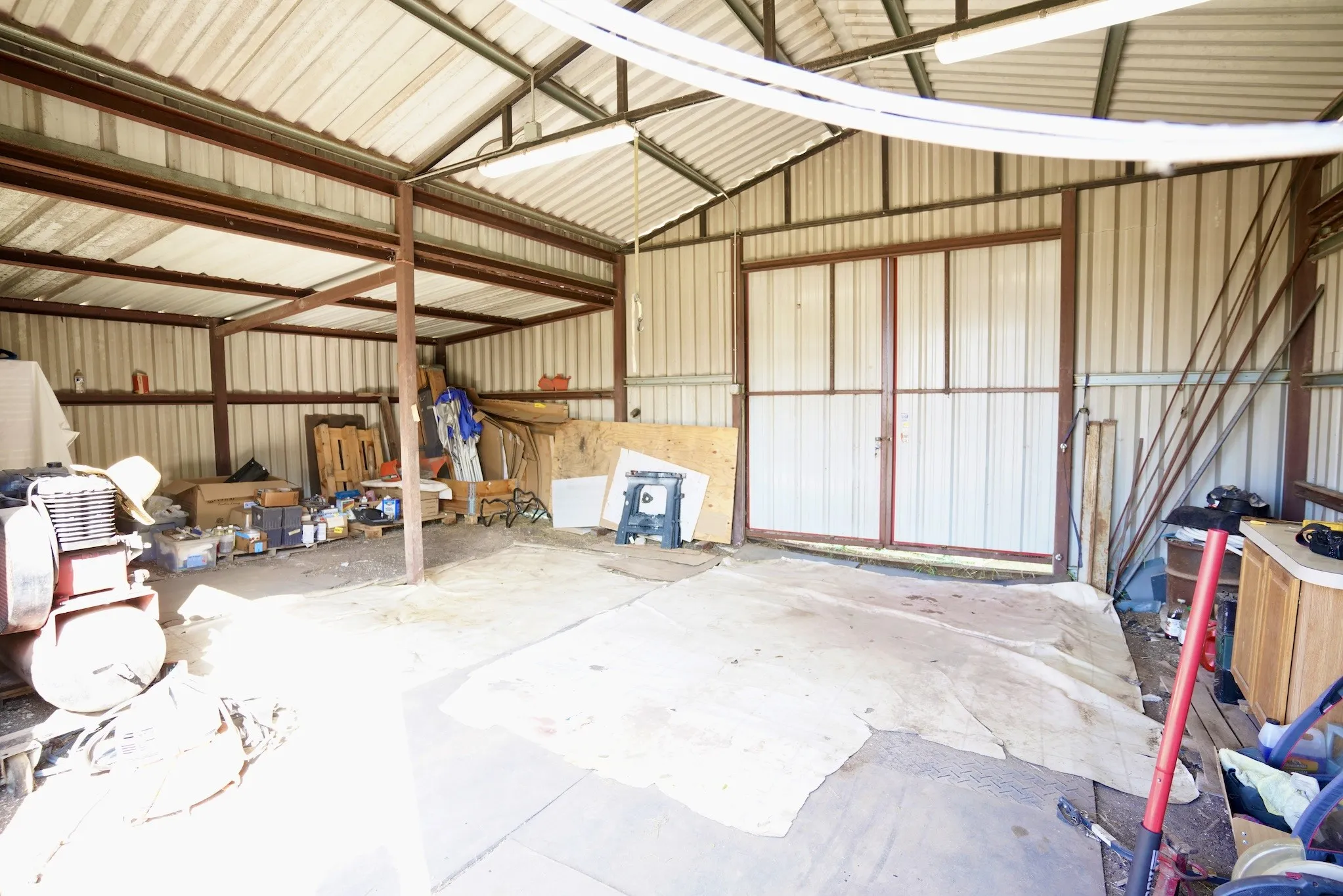 Garage featuring metal wall