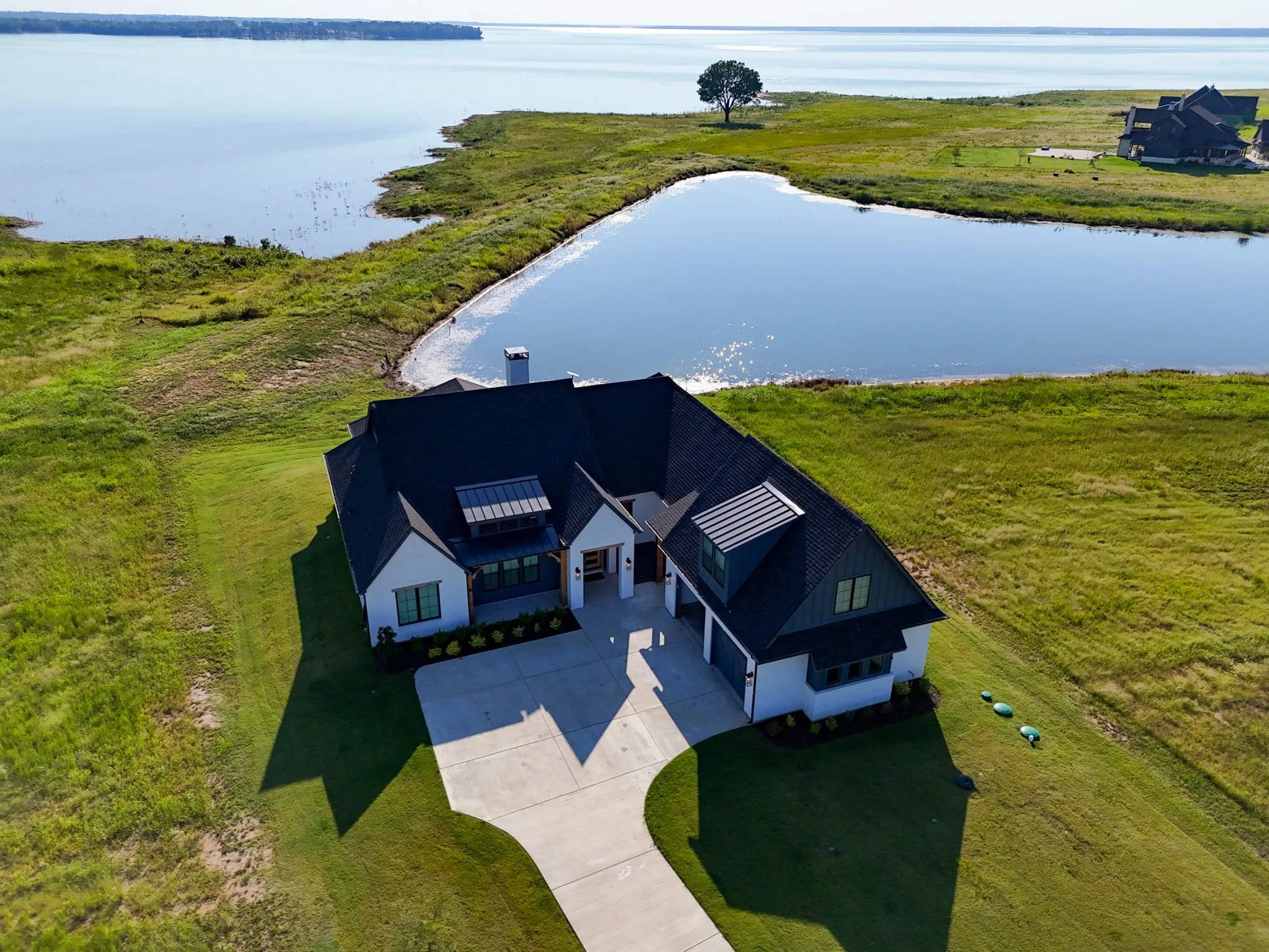 View from above of property with a large body of water