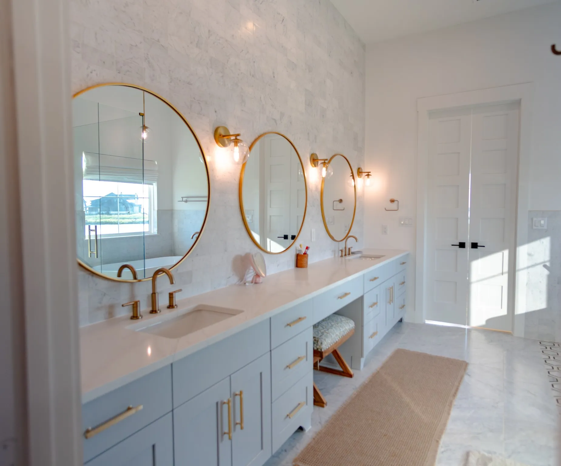 Full bathroom featuring double vanity and light tile patterned flooring