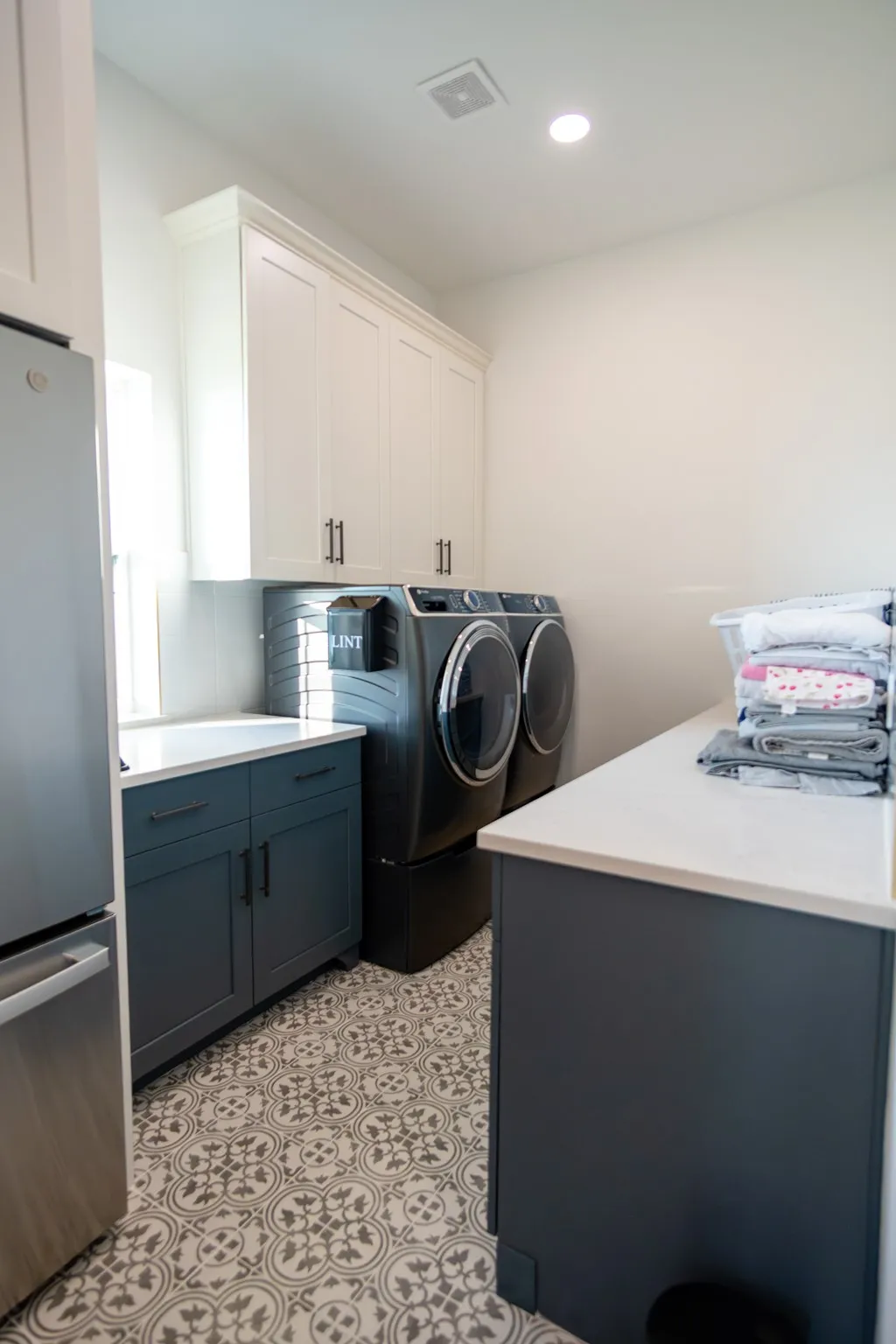 Laundry area featuring washing machine and dryer and recessed lighting
