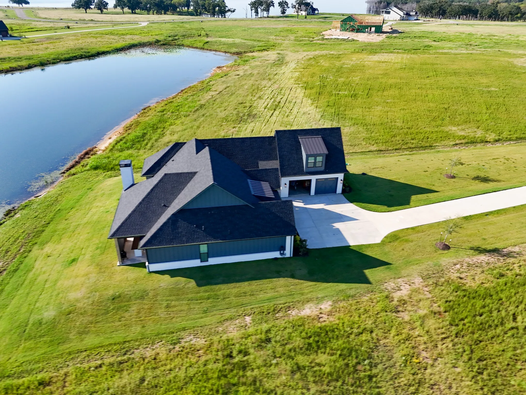 Overview of rural landscape with a nearby body of water