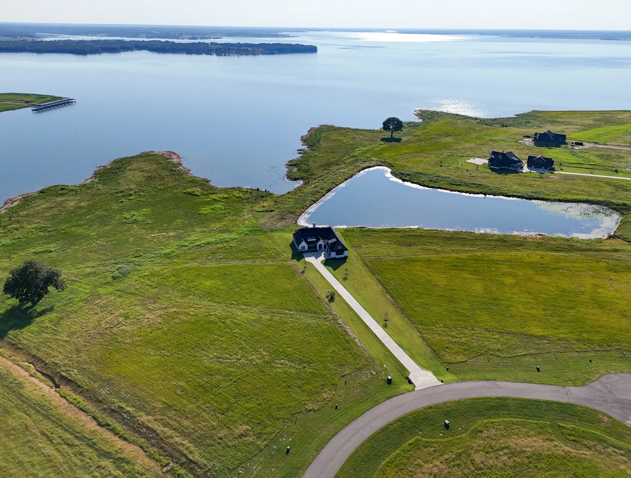 Aerial overview of property's location featuring a large body of water