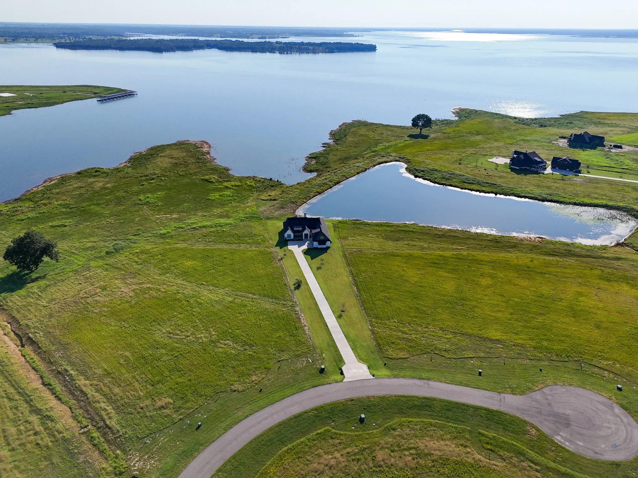 Aerial view of property's location featuring a nearby body of water