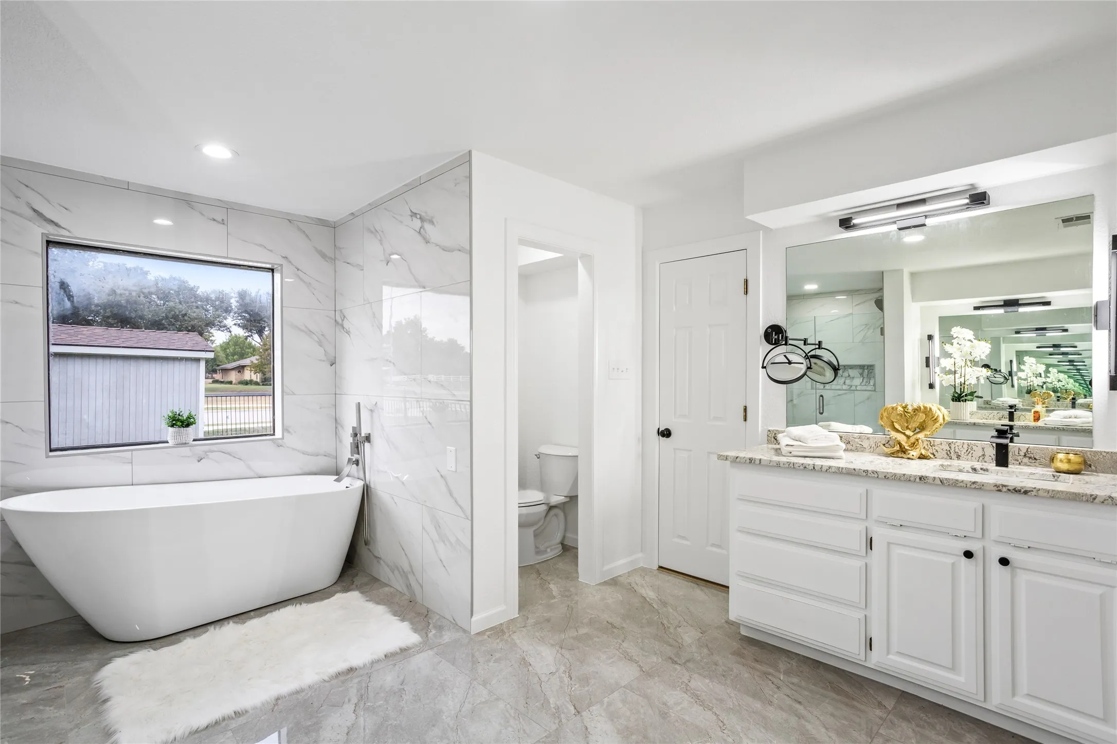 Double vanities across the room from each other - so spacious