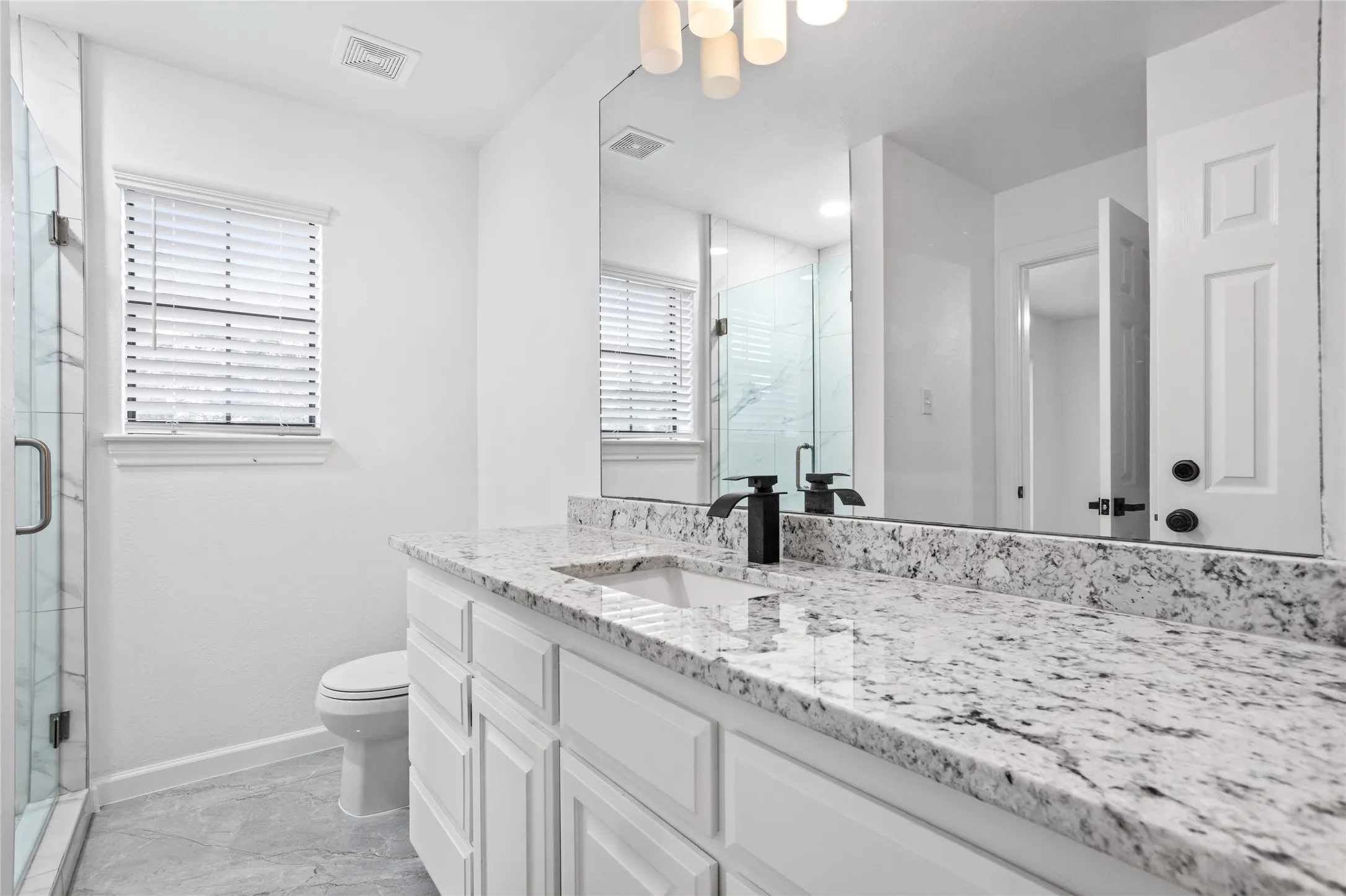 1 of 2 full bathrooms, new tile, countertops, all new finishes in each