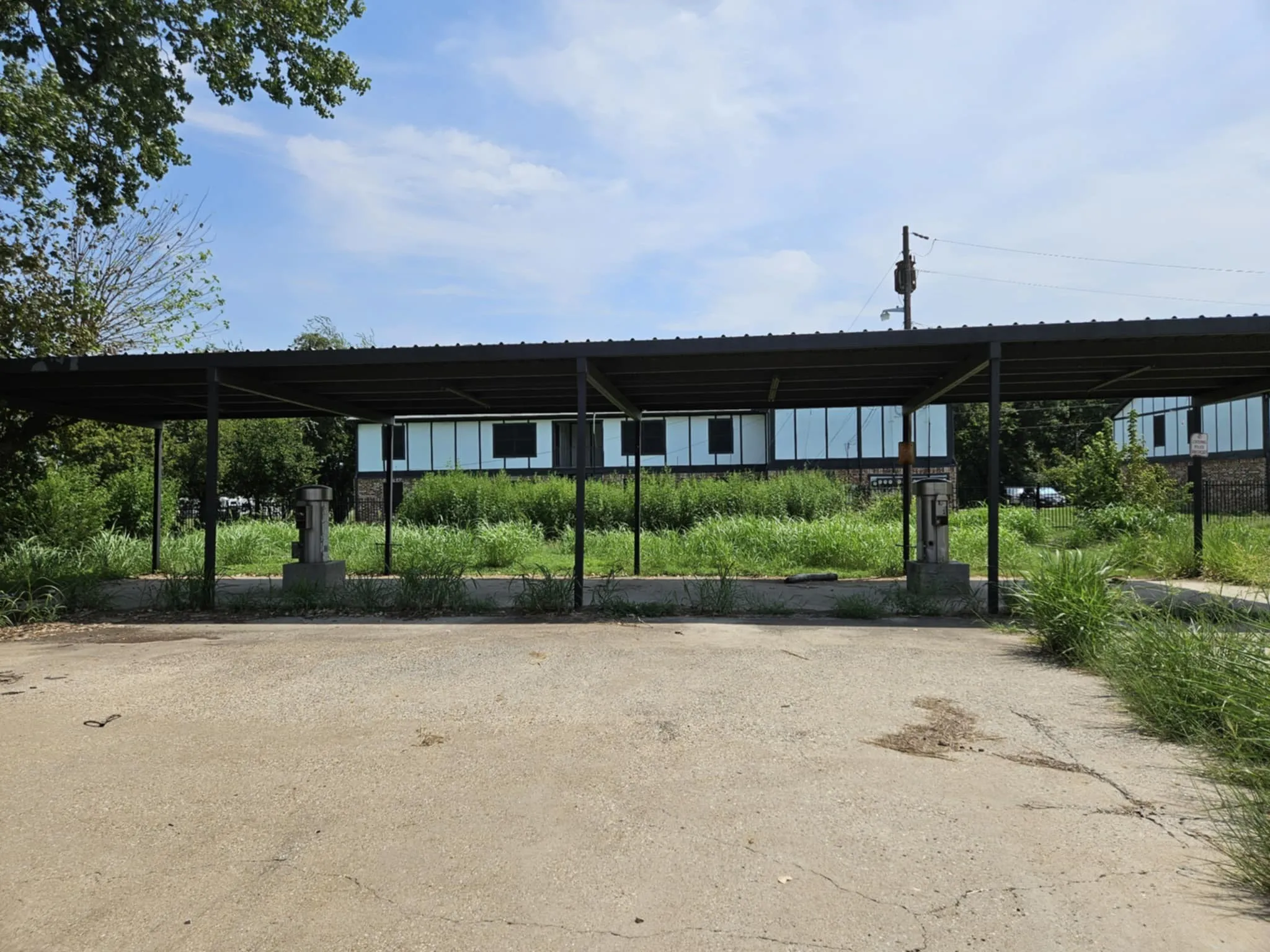 View of vehicle parking with a detached carport