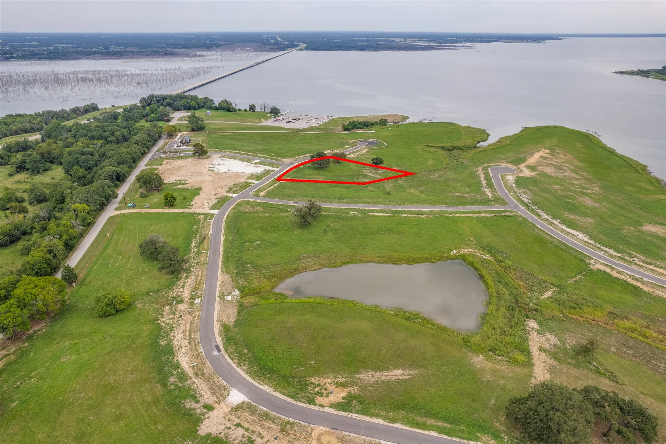 View of property location featuring a large body of water and property parcel outlined