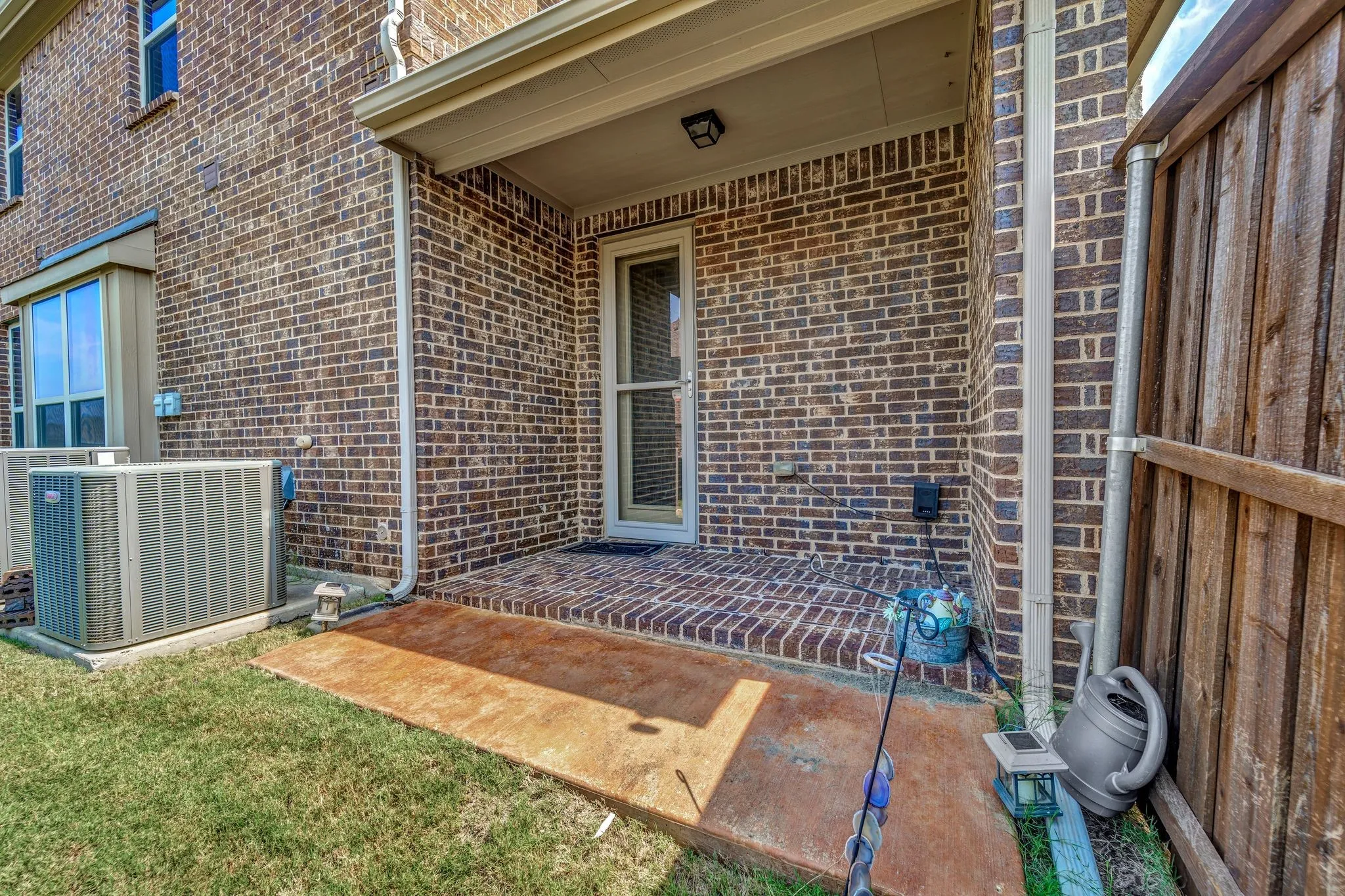 Covered side to patio to private apartment.