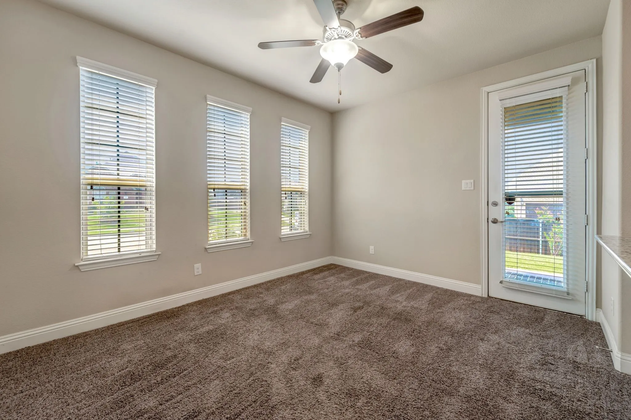 Private apartment features it's own side covered patio with storm door also!