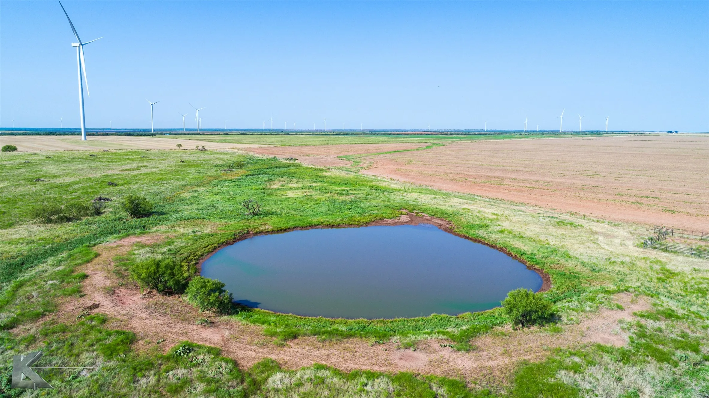 Surrounding community with a view of rural / pastoral area, agricultural plots, and a water view
