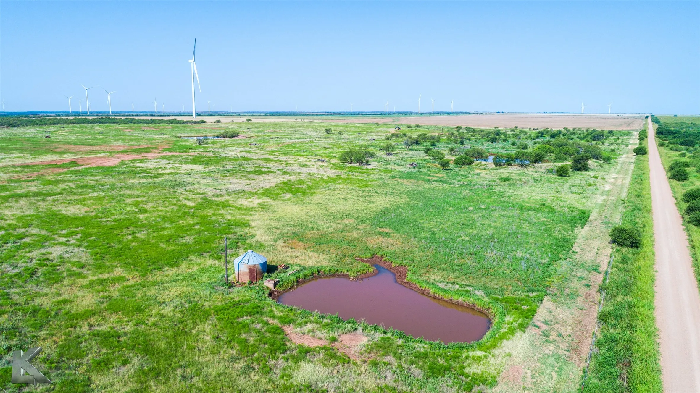 Aerial view of sparsely populated area with a large body of water