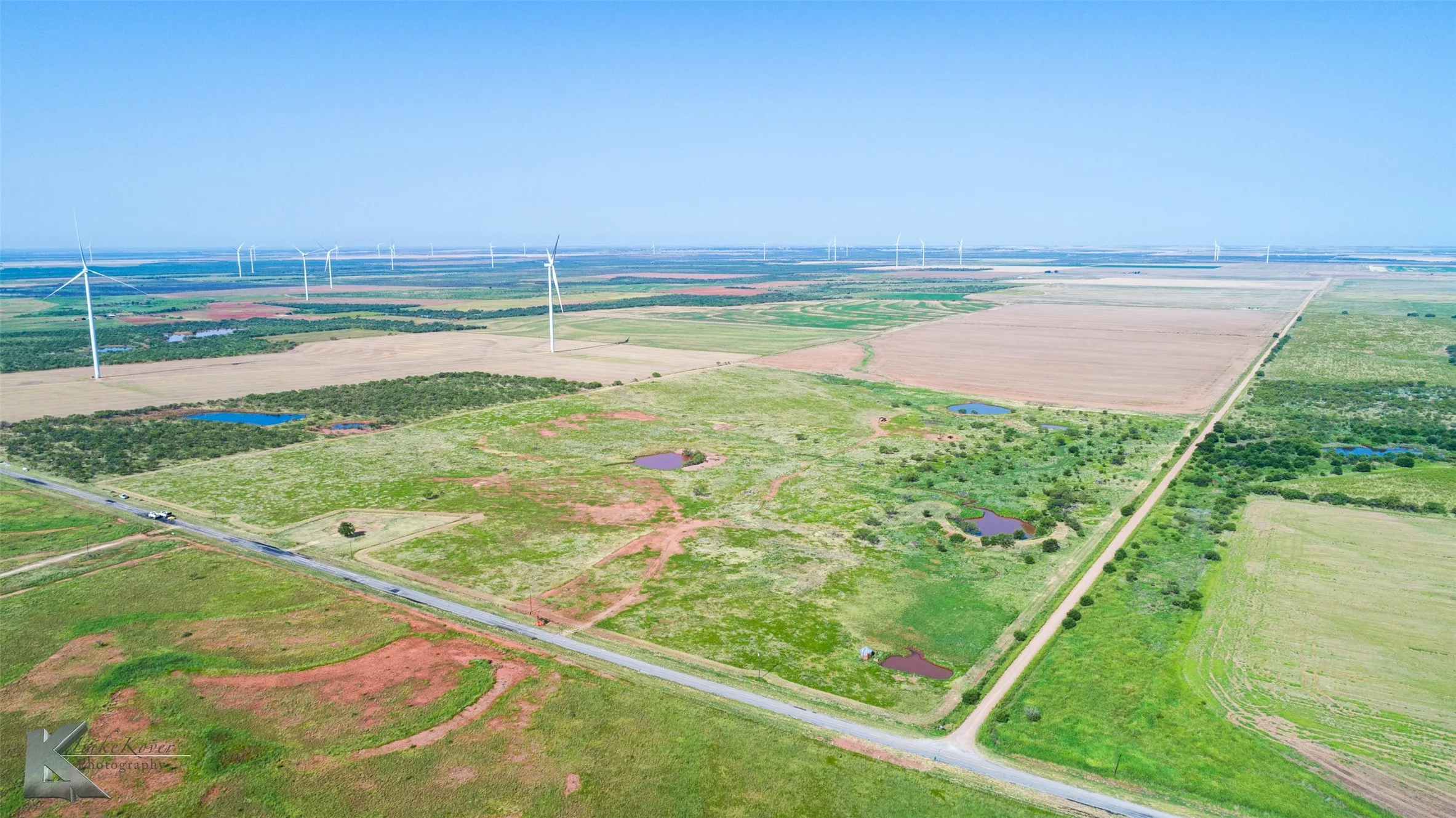 Aerial view of sparsely populated area with farmland